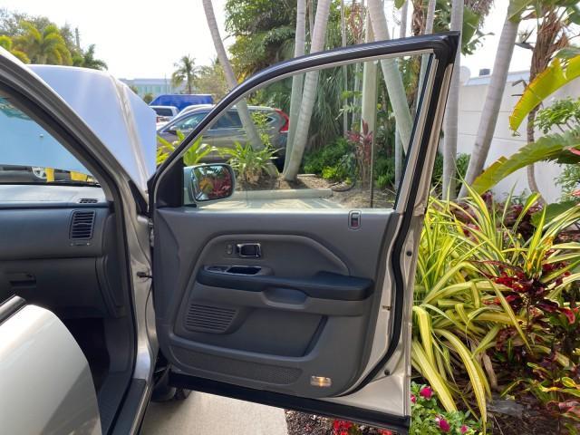 2004 Starlight Silver Metallic /Gray Honda Pilot EX-L 4WD LOW MILES 64,262 (2HKYF18574H) with an 3.5L SOHC PGM-FI 24-Valve VTEC V6 Engine engine, Automatic transmission, located at 4701 North Dixie Hwy, Pompano Beach, FL, 33064, (954) 422-2889, 26.240938, -80.123474 - OUR WEBPAGE FLORIDACARS1.COM HAS OVER 100 PHOTOS AND FREE CARFAX LINK 2004 Honda Pilot EX-L 4WD/AWD 4 Door Wagon/Sport Utility 3.5L V6 F SOHC Gasoline 22 MPG All Wheel Drive Features 4WD/AWD ABS Brakes Air Conditioning Alloy Wheels AM/FM Stereo Automatic Transmission Cassette Player CD Audio Cruise- Photo#11