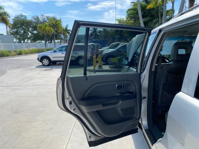 2004 Starlight Silver Metallic /Gray Honda Pilot EX-L 4WD LOW MILES 64,262 (2HKYF18574H) with an 3.5L SOHC PGM-FI 24-Valve VTEC V6 Engine engine, Automatic transmission, located at 4701 North Dixie Hwy, Pompano Beach, FL, 33064, (954) 422-2889, 26.240938, -80.123474 - OUR WEBPAGE FLORIDACARS1.COM HAS OVER 100 PHOTOS AND FREE CARFAX LINK 2004 Honda Pilot EX-L 4WD/AWD 4 Door Wagon/Sport Utility 3.5L V6 F SOHC Gasoline 22 MPG All Wheel Drive Features 4WD/AWD ABS Brakes Air Conditioning Alloy Wheels AM/FM Stereo Automatic Transmission Cassette Player CD Audio Cruise- Photo#13