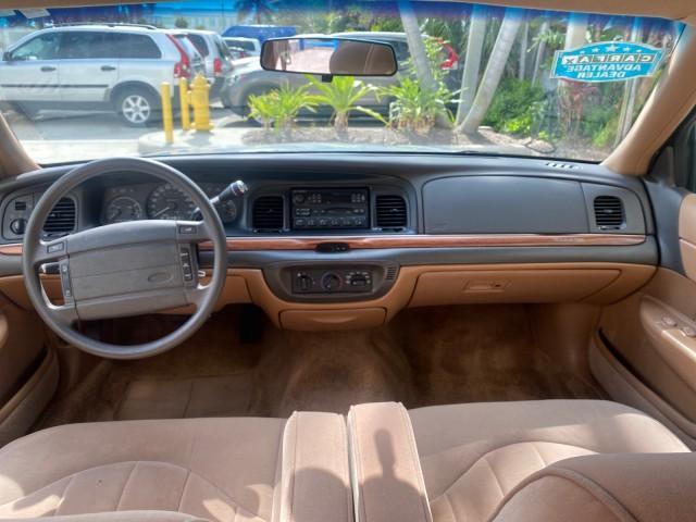 1995 White /Tan Ford Crown Victoria LOW MILES 43,331 (2FALP73W4SX) with an 4.6L 8-Cyl Engine engine, Automatic transmission, located at 4701 North Dixie Hwy, Pompano Beach, FL, 33064, (954) 422-2889, 26.240938, -80.123474 - OUR WEBPAGE FLORIDACARS1.COM HAS OVER 100 PHOTOS AND FREE CARFAX LINK 1995 Ford Crown Victoria Sedan 4 DR 4.6L V8 F SOHC 16V Gasoline Rear Wheel Drive Features Air Conditioning AM/FM Stereo Automatic Transmission Cassette Player Cloth Seats Cruise Control Power Locks Power Seat(s) Power Windows Rear- Photo#83