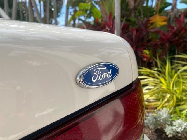 1995 White /Tan Ford Crown Victoria LOW MILES 43,331 (2FALP73W4SX) with an 4.6L 8-Cyl Engine engine, Automatic transmission, located at 4701 North Dixie Hwy, Pompano Beach, FL, 33064, (954) 422-2889, 26.240938, -80.123474 - OUR WEBPAGE FLORIDACARS1.COM HAS OVER 100 PHOTOS AND FREE CARFAX LINK 1995 Ford Crown Victoria Sedan 4 DR 4.6L V8 F SOHC 16V Gasoline Rear Wheel Drive Features Air Conditioning AM/FM Stereo Automatic Transmission Cassette Player Cloth Seats Cruise Control Power Locks Power Seat(s) Power Windows Rear- Photo#94