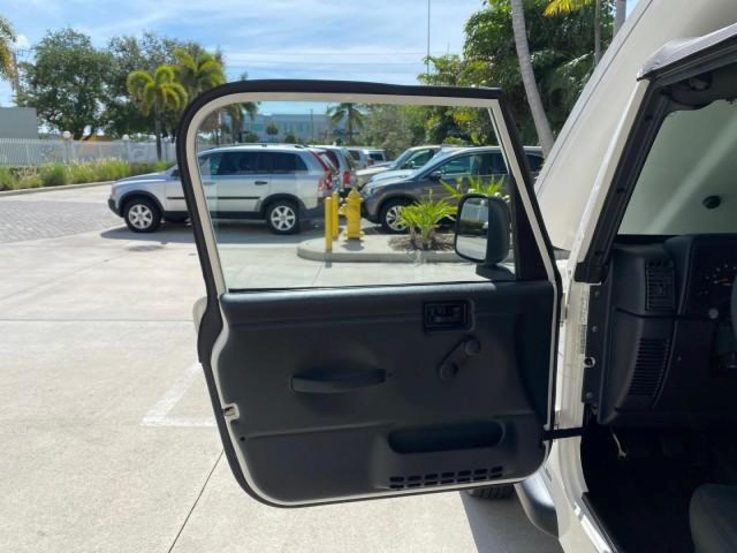 2005 Stone White /Dark Slate Gray Jeep Wrangler SE 4WD LOW MILES 29,371 1 OWNER (1J4FA29105P) with an 2.4L SMPI DOHC 16v 4-Cyl Engine engine, Manual transmission, located at 4701 North Dixie Hwy, Pompano Beach, FL, 33064, (954) 422-2889, 26.240938, -80.123474 - OUR WEBPAGE FLORIDACARS1.COM HAS OVER 100 PHOTOS AND FREE CARFAX LINK 2005 Jeep Wrangler SE 4WD 1 OWNER FACTORY ICE COLD AC 6 SPEED MANUAL Utility 2.4L I4 F Gasoline 21 MPG Rear Wheel Drive w/ 4X4 Features 4WD/AWD Air Conditioning Alloy Wheels AM/FM Stereo CD Audio Cloth Seats Manual Transmission So- Photo#9