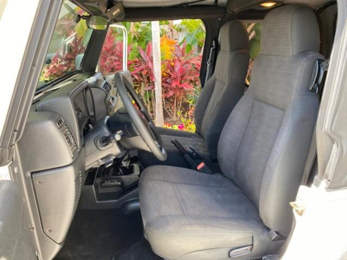 2005 Stone White /Dark Slate Gray Jeep Wrangler SE 4WD LOW MILES 29,371 1 OWNER (1J4FA29105P) with an 2.4L SMPI DOHC 16v 4-Cyl Engine engine, Manual transmission, located at 4701 North Dixie Hwy, Pompano Beach, FL, 33064, (954) 422-2889, 26.240938, -80.123474 - OUR WEBPAGE FLORIDACARS1.COM HAS OVER 100 PHOTOS AND FREE CARFAX LINK 2005 Jeep Wrangler SE 4WD 1 OWNER FACTORY ICE COLD AC 6 SPEED MANUAL Utility 2.4L I4 F Gasoline 21 MPG Rear Wheel Drive w/ 4X4 Features 4WD/AWD Air Conditioning Alloy Wheels AM/FM Stereo CD Audio Cloth Seats Manual Transmission So- Photo#10