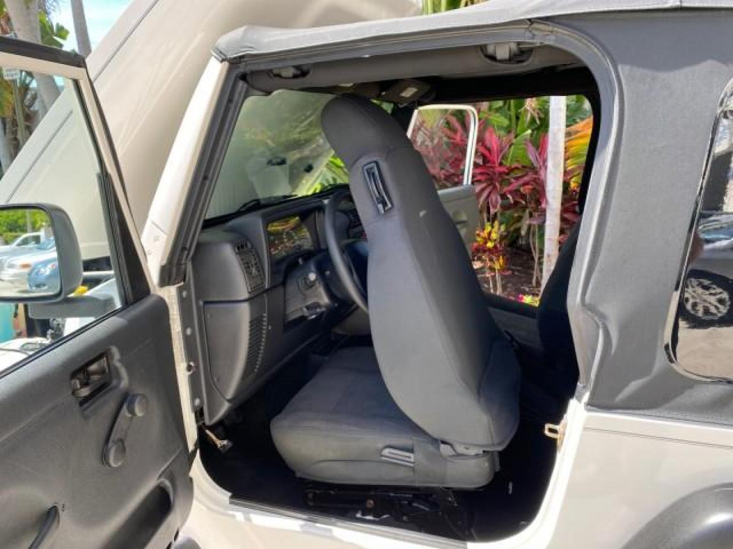 2005 Stone White /Dark Slate Gray Jeep Wrangler SE 4WD LOW MILES 29,371 1 OWNER (1J4FA29105P) with an 2.4L SMPI DOHC 16v 4-Cyl Engine engine, Manual transmission, located at 4701 North Dixie Hwy, Pompano Beach, FL, 33064, (954) 422-2889, 26.240938, -80.123474 - OUR WEBPAGE FLORIDACARS1.COM HAS OVER 100 PHOTOS AND FREE CARFAX LINK 2005 Jeep Wrangler SE 4WD 1 OWNER FACTORY ICE COLD AC 6 SPEED MANUAL Utility 2.4L I4 F Gasoline 21 MPG Rear Wheel Drive w/ 4X4 Features 4WD/AWD Air Conditioning Alloy Wheels AM/FM Stereo CD Audio Cloth Seats Manual Transmission So- Photo#13