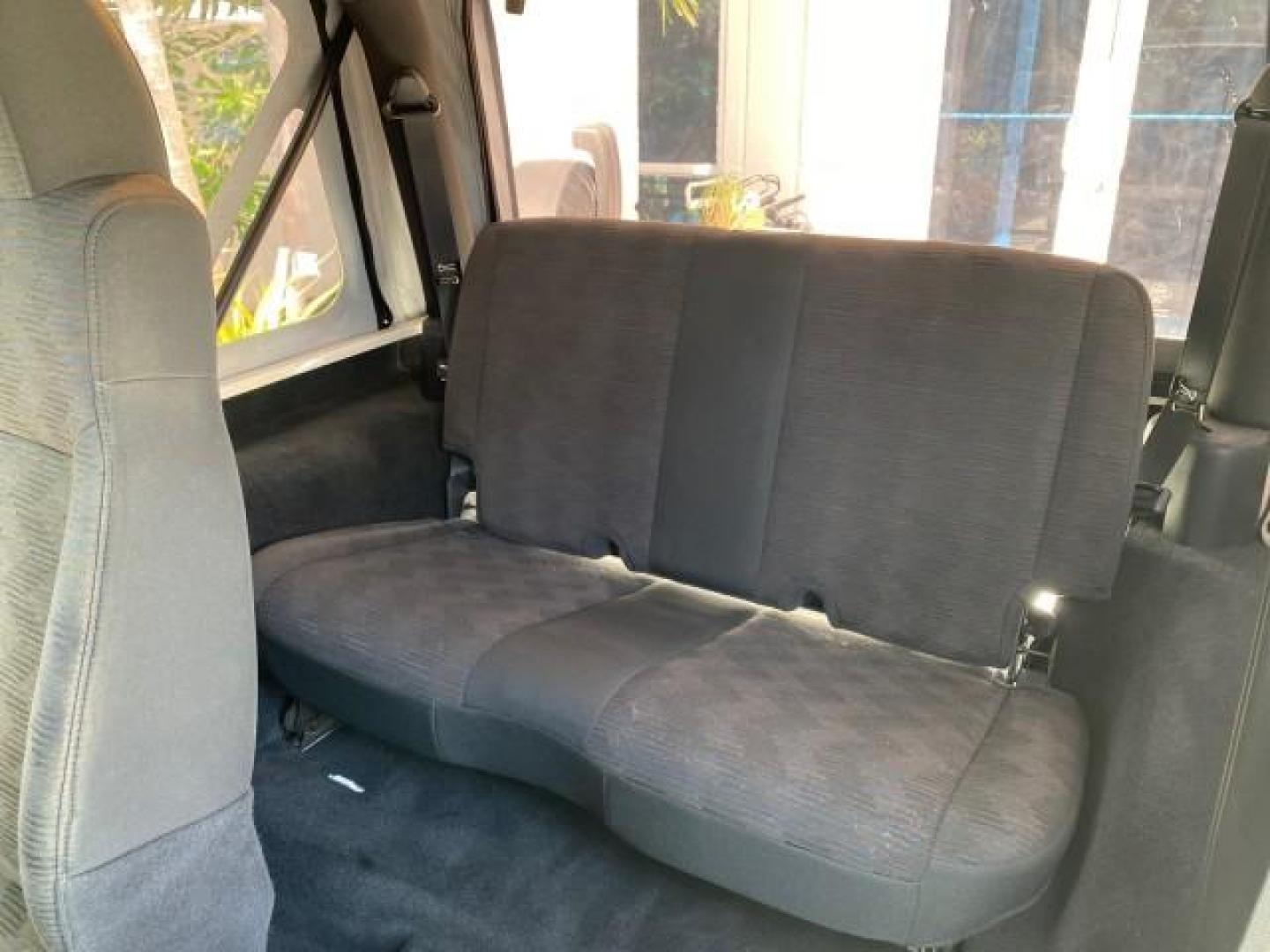 2005 Stone White /Dark Slate Gray Jeep Wrangler SE 4WD LOW MILES 29,371 1 OWNER (1J4FA29105P) with an 2.4L SMPI DOHC 16v 4-Cyl Engine engine, Manual transmission, located at 4701 North Dixie Hwy, Pompano Beach, FL, 33064, (954) 422-2889, 26.240938, -80.123474 - OUR WEBPAGE FLORIDACARS1.COM HAS OVER 100 PHOTOS AND FREE CARFAX LINK 2005 Jeep Wrangler SE 4WD 1 OWNER FACTORY ICE COLD AC 6 SPEED MANUAL Utility 2.4L I4 F Gasoline 21 MPG Rear Wheel Drive w/ 4X4 Features 4WD/AWD Air Conditioning Alloy Wheels AM/FM Stereo CD Audio Cloth Seats Manual Transmission So- Photo#14