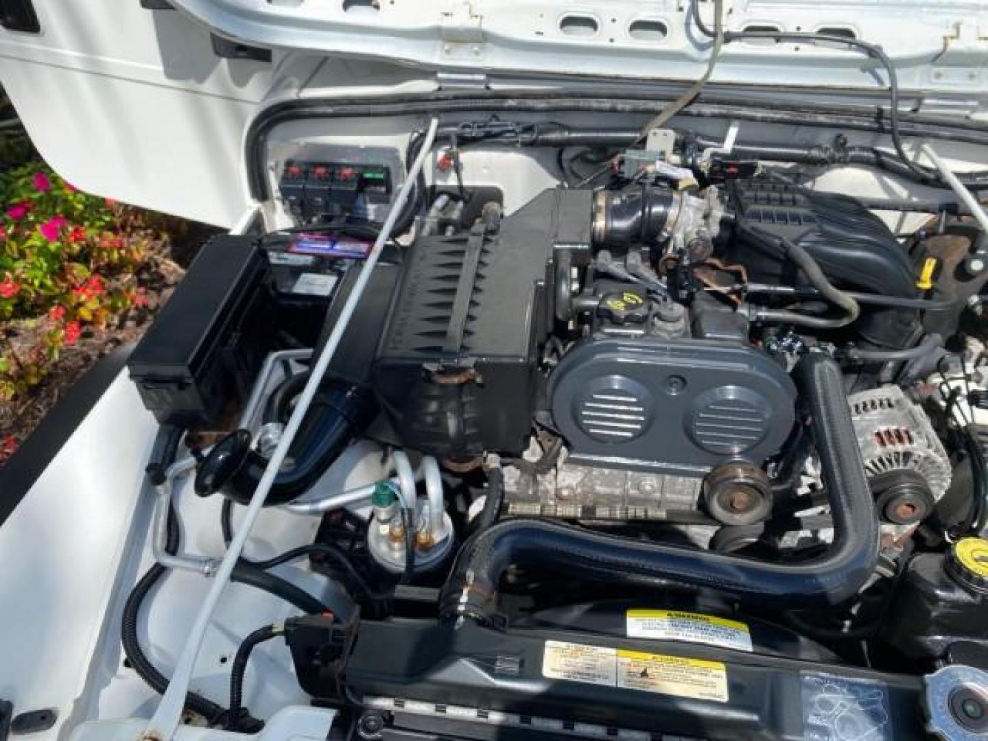 2005 Stone White /Dark Slate Gray Jeep Wrangler SE 4WD LOW MILES 29,371 1 OWNER (1J4FA29105P) with an 2.4L SMPI DOHC 16v 4-Cyl Engine engine, Manual transmission, located at 4701 North Dixie Hwy, Pompano Beach, FL, 33064, (954) 422-2889, 26.240938, -80.123474 - OUR WEBPAGE FLORIDACARS1.COM HAS OVER 100 PHOTOS AND FREE CARFAX LINK 2005 Jeep Wrangler SE 4WD 1 OWNER FACTORY ICE COLD AC 6 SPEED MANUAL Utility 2.4L I4 F Gasoline 21 MPG Rear Wheel Drive w/ 4X4 Features 4WD/AWD Air Conditioning Alloy Wheels AM/FM Stereo CD Audio Cloth Seats Manual Transmission So- Photo#24