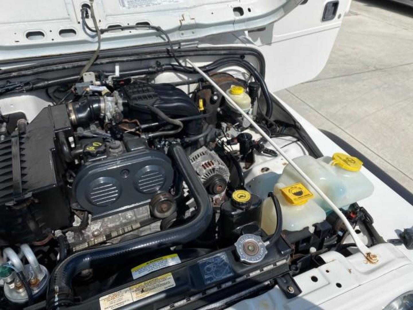 2005 Stone White /Dark Slate Gray Jeep Wrangler SE 4WD LOW MILES 29,371 1 OWNER (1J4FA29105P) with an 2.4L SMPI DOHC 16v 4-Cyl Engine engine, Manual transmission, located at 4701 North Dixie Hwy, Pompano Beach, FL, 33064, (954) 422-2889, 26.240938, -80.123474 - OUR WEBPAGE FLORIDACARS1.COM HAS OVER 100 PHOTOS AND FREE CARFAX LINK 2005 Jeep Wrangler SE 4WD 1 OWNER FACTORY ICE COLD AC 6 SPEED MANUAL Utility 2.4L I4 F Gasoline 21 MPG Rear Wheel Drive w/ 4X4 Features 4WD/AWD Air Conditioning Alloy Wheels AM/FM Stereo CD Audio Cloth Seats Manual Transmission So- Photo#25