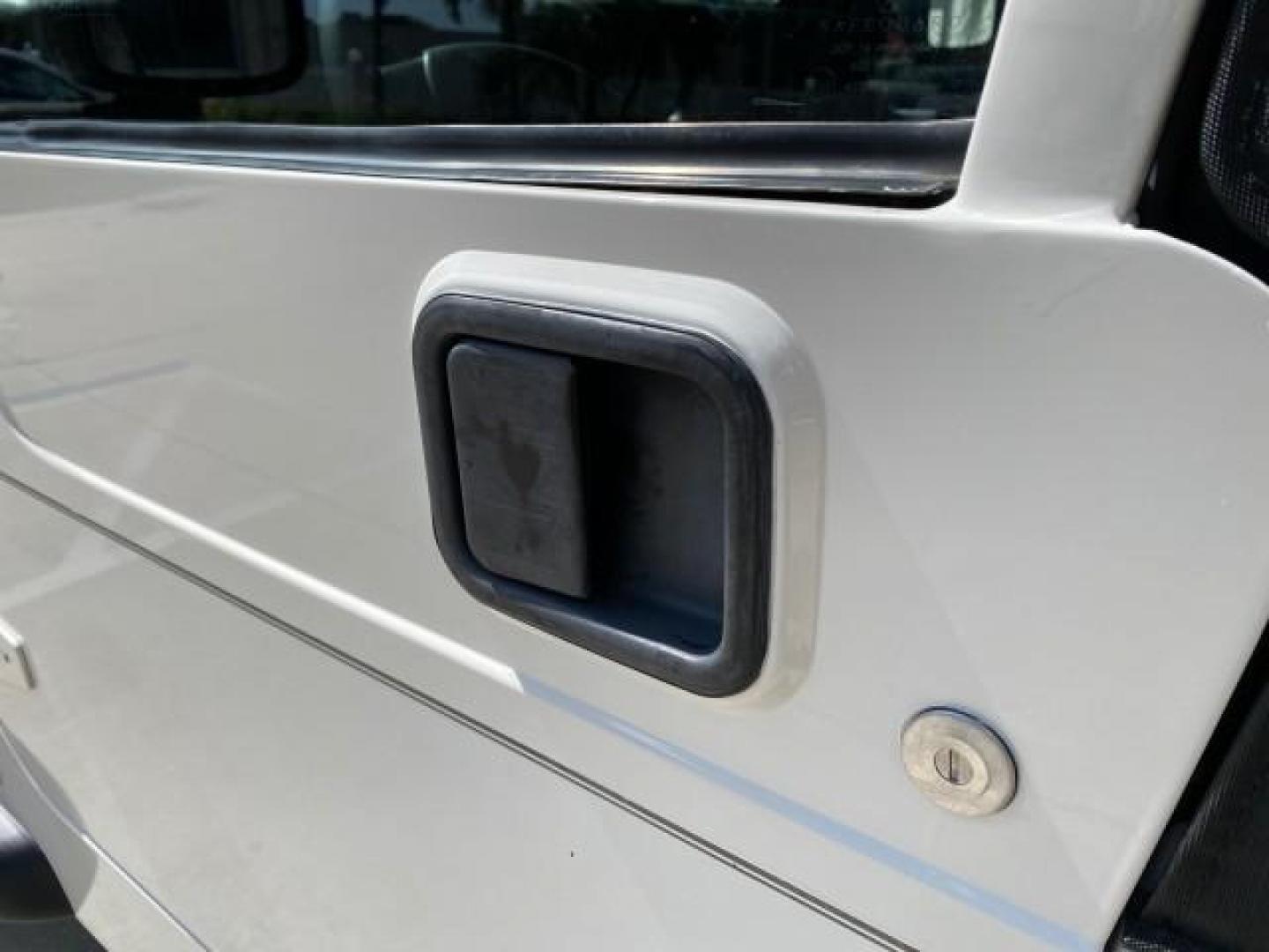 2005 Stone White /Dark Slate Gray Jeep Wrangler SE 4WD LOW MILES 29,371 1 OWNER (1J4FA29105P) with an 2.4L SMPI DOHC 16v 4-Cyl Engine engine, Manual transmission, located at 4701 North Dixie Hwy, Pompano Beach, FL, 33064, (954) 422-2889, 26.240938, -80.123474 - OUR WEBPAGE FLORIDACARS1.COM HAS OVER 100 PHOTOS AND FREE CARFAX LINK 2005 Jeep Wrangler SE 4WD 1 OWNER FACTORY ICE COLD AC 6 SPEED MANUAL Utility 2.4L I4 F Gasoline 21 MPG Rear Wheel Drive w/ 4X4 Features 4WD/AWD Air Conditioning Alloy Wheels AM/FM Stereo CD Audio Cloth Seats Manual Transmission So- Photo#37