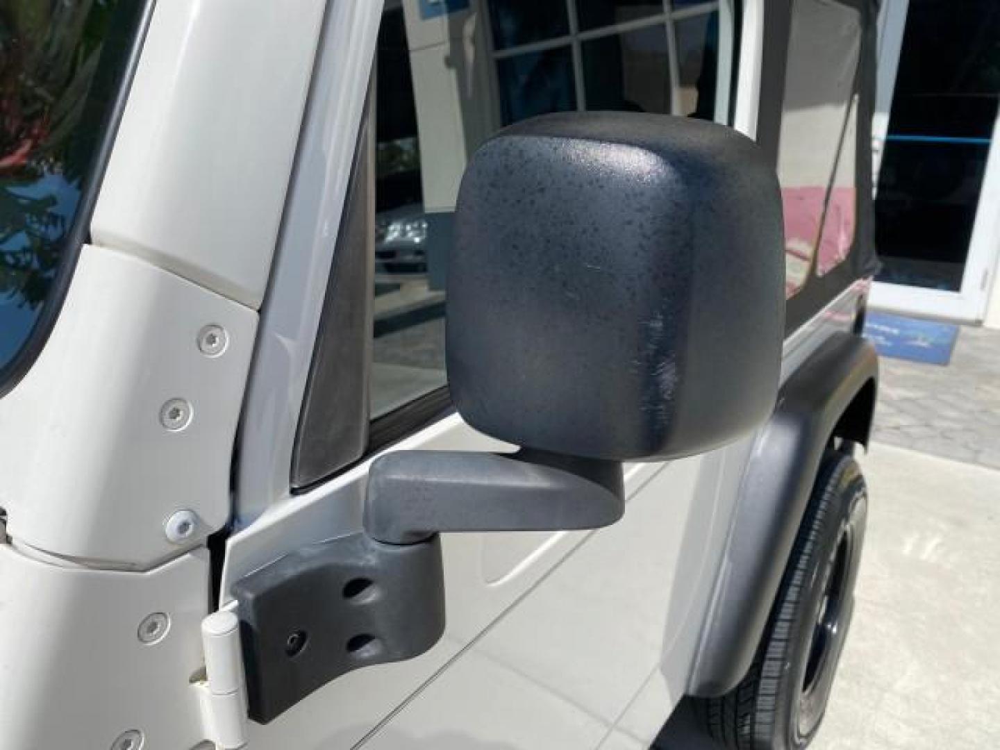 2005 Stone White /Dark Slate Gray Jeep Wrangler SE 4WD LOW MILES 29,371 1 OWNER (1J4FA29105P) with an 2.4L SMPI DOHC 16v 4-Cyl Engine engine, Manual transmission, located at 4701 North Dixie Hwy, Pompano Beach, FL, 33064, (954) 422-2889, 26.240938, -80.123474 - OUR WEBPAGE FLORIDACARS1.COM HAS OVER 100 PHOTOS AND FREE CARFAX LINK 2005 Jeep Wrangler SE 4WD 1 OWNER FACTORY ICE COLD AC 6 SPEED MANUAL Utility 2.4L I4 F Gasoline 21 MPG Rear Wheel Drive w/ 4X4 Features 4WD/AWD Air Conditioning Alloy Wheels AM/FM Stereo CD Audio Cloth Seats Manual Transmission So- Photo#39