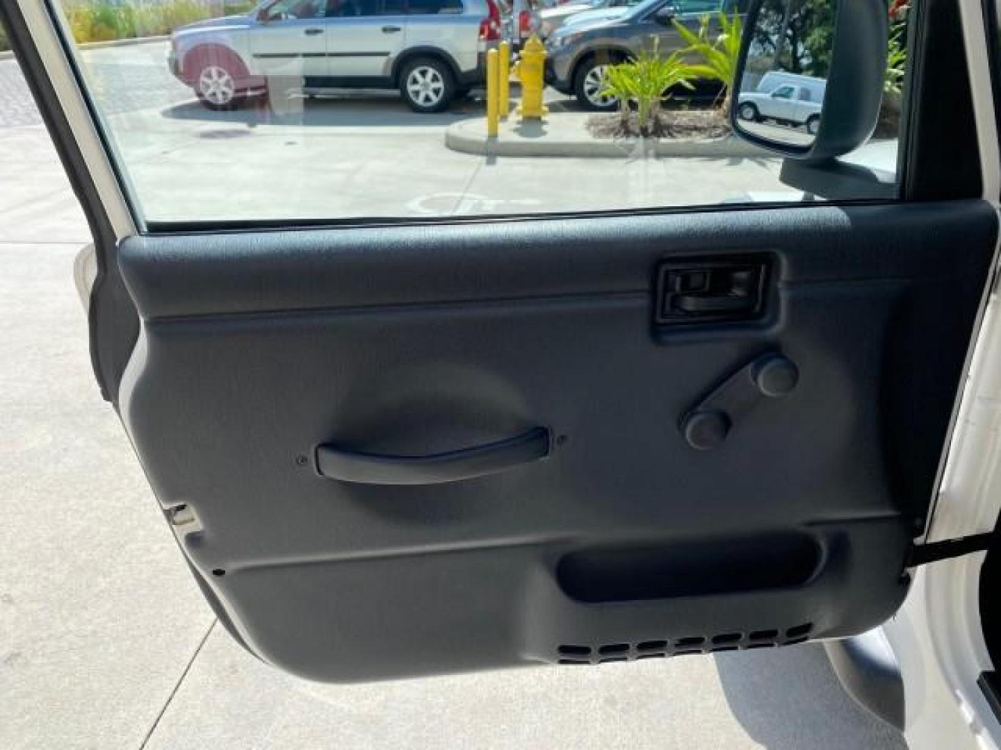 2005 Stone White /Dark Slate Gray Jeep Wrangler SE 4WD LOW MILES 29,371 1 OWNER (1J4FA29105P) with an 2.4L SMPI DOHC 16v 4-Cyl Engine engine, Manual transmission, located at 4701 North Dixie Hwy, Pompano Beach, FL, 33064, (954) 422-2889, 26.240938, -80.123474 - OUR WEBPAGE FLORIDACARS1.COM HAS OVER 100 PHOTOS AND FREE CARFAX LINK 2005 Jeep Wrangler SE 4WD 1 OWNER FACTORY ICE COLD AC 6 SPEED MANUAL Utility 2.4L I4 F Gasoline 21 MPG Rear Wheel Drive w/ 4X4 Features 4WD/AWD Air Conditioning Alloy Wheels AM/FM Stereo CD Audio Cloth Seats Manual Transmission So- Photo#42