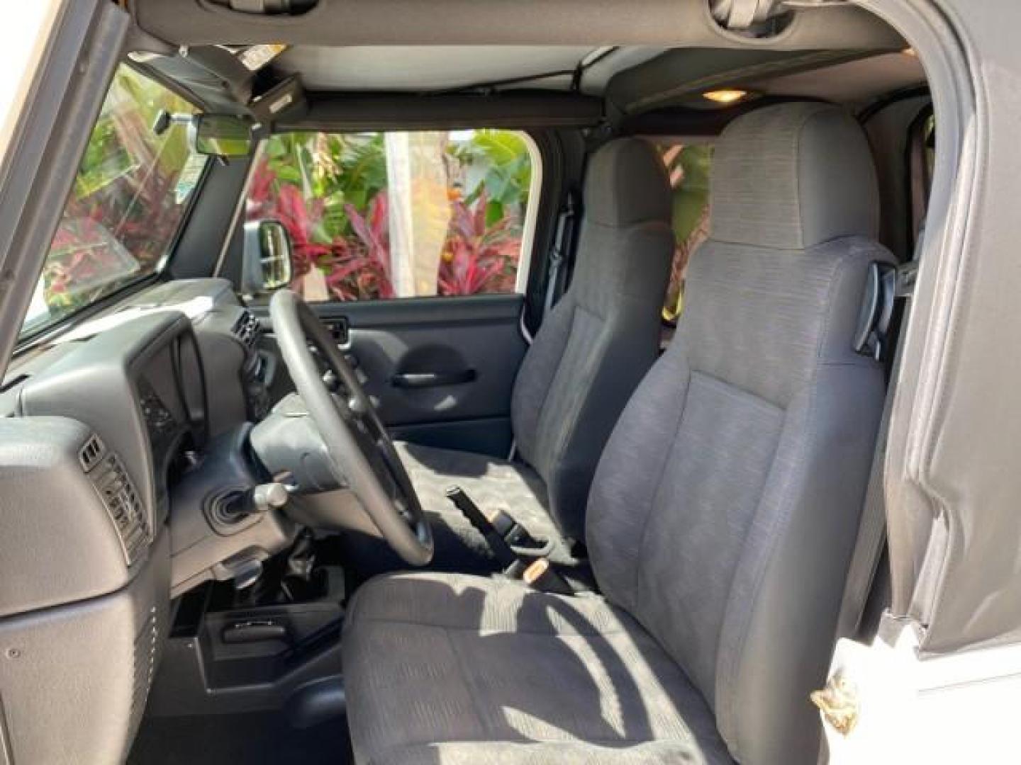 2005 Stone White /Dark Slate Gray Jeep Wrangler SE 4WD LOW MILES 29,371 1 OWNER (1J4FA29105P) with an 2.4L SMPI DOHC 16v 4-Cyl Engine engine, Manual transmission, located at 4701 North Dixie Hwy, Pompano Beach, FL, 33064, (954) 422-2889, 26.240938, -80.123474 - OUR WEBPAGE FLORIDACARS1.COM HAS OVER 100 PHOTOS AND FREE CARFAX LINK 2005 Jeep Wrangler SE 4WD 1 OWNER FACTORY ICE COLD AC 6 SPEED MANUAL Utility 2.4L I4 F Gasoline 21 MPG Rear Wheel Drive w/ 4X4 Features 4WD/AWD Air Conditioning Alloy Wheels AM/FM Stereo CD Audio Cloth Seats Manual Transmission So- Photo#43