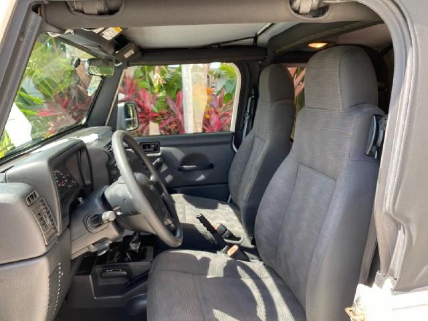 2005 Stone White /Dark Slate Gray Jeep Wrangler SE 4WD LOW MILES 29,371 1 OWNER (1J4FA29105P) with an 2.4L SMPI DOHC 16v 4-Cyl Engine engine, Manual transmission, located at 4701 North Dixie Hwy, Pompano Beach, FL, 33064, (954) 422-2889, 26.240938, -80.123474 - OUR WEBPAGE FLORIDACARS1.COM HAS OVER 100 PHOTOS AND FREE CARFAX LINK 2005 Jeep Wrangler SE 4WD 1 OWNER FACTORY ICE COLD AC 6 SPEED MANUAL Utility 2.4L I4 F Gasoline 21 MPG Rear Wheel Drive w/ 4X4 Features 4WD/AWD Air Conditioning Alloy Wheels AM/FM Stereo CD Audio Cloth Seats Manual Transmission So- Photo#44