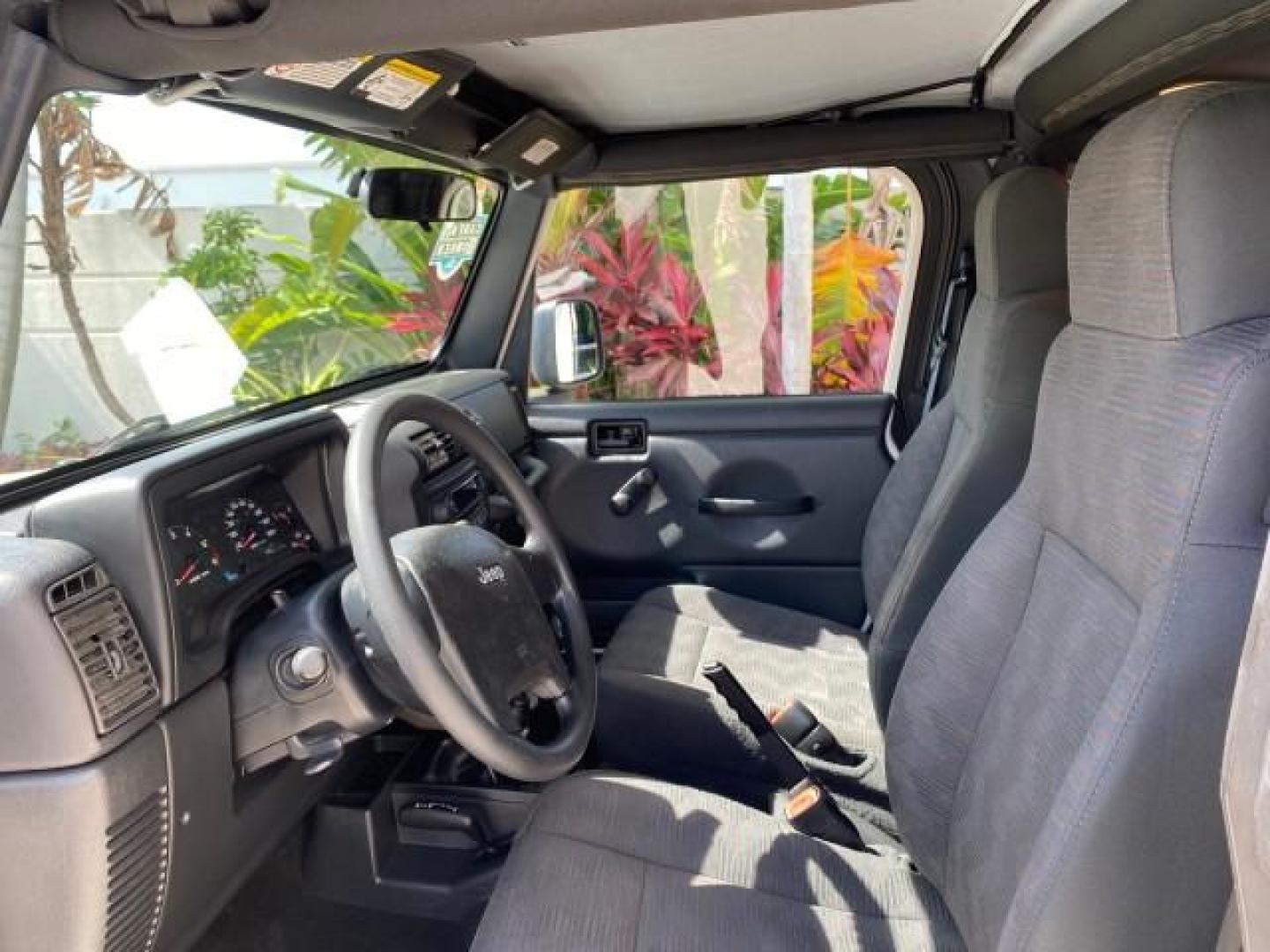 2005 Stone White /Dark Slate Gray Jeep Wrangler SE 4WD LOW MILES 29,371 1 OWNER (1J4FA29105P) with an 2.4L SMPI DOHC 16v 4-Cyl Engine engine, Manual transmission, located at 4701 North Dixie Hwy, Pompano Beach, FL, 33064, (954) 422-2889, 26.240938, -80.123474 - OUR WEBPAGE FLORIDACARS1.COM HAS OVER 100 PHOTOS AND FREE CARFAX LINK 2005 Jeep Wrangler SE 4WD 1 OWNER FACTORY ICE COLD AC 6 SPEED MANUAL Utility 2.4L I4 F Gasoline 21 MPG Rear Wheel Drive w/ 4X4 Features 4WD/AWD Air Conditioning Alloy Wheels AM/FM Stereo CD Audio Cloth Seats Manual Transmission So- Photo#45