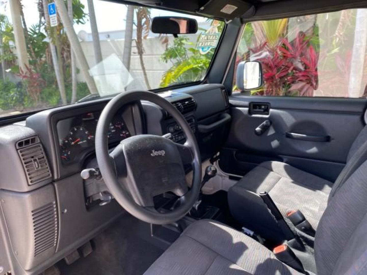 2005 Stone White /Dark Slate Gray Jeep Wrangler SE 4WD LOW MILES 29,371 1 OWNER (1J4FA29105P) with an 2.4L SMPI DOHC 16v 4-Cyl Engine engine, Manual transmission, located at 4701 North Dixie Hwy, Pompano Beach, FL, 33064, (954) 422-2889, 26.240938, -80.123474 - OUR WEBPAGE FLORIDACARS1.COM HAS OVER 100 PHOTOS AND FREE CARFAX LINK 2005 Jeep Wrangler SE 4WD 1 OWNER FACTORY ICE COLD AC 6 SPEED MANUAL Utility 2.4L I4 F Gasoline 21 MPG Rear Wheel Drive w/ 4X4 Features 4WD/AWD Air Conditioning Alloy Wheels AM/FM Stereo CD Audio Cloth Seats Manual Transmission So- Photo#47