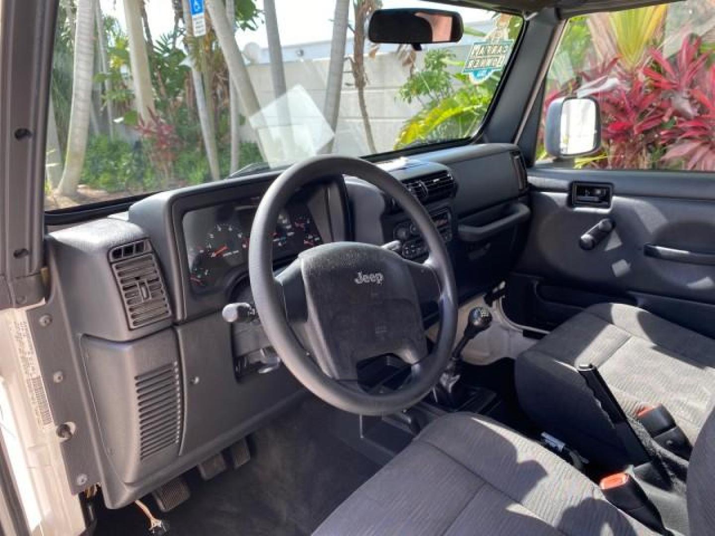 2005 Stone White /Dark Slate Gray Jeep Wrangler SE 4WD LOW MILES 29,371 1 OWNER (1J4FA29105P) with an 2.4L SMPI DOHC 16v 4-Cyl Engine engine, Manual transmission, located at 4701 North Dixie Hwy, Pompano Beach, FL, 33064, (954) 422-2889, 26.240938, -80.123474 - OUR WEBPAGE FLORIDACARS1.COM HAS OVER 100 PHOTOS AND FREE CARFAX LINK 2005 Jeep Wrangler SE 4WD 1 OWNER FACTORY ICE COLD AC 6 SPEED MANUAL Utility 2.4L I4 F Gasoline 21 MPG Rear Wheel Drive w/ 4X4 Features 4WD/AWD Air Conditioning Alloy Wheels AM/FM Stereo CD Audio Cloth Seats Manual Transmission So- Photo#48