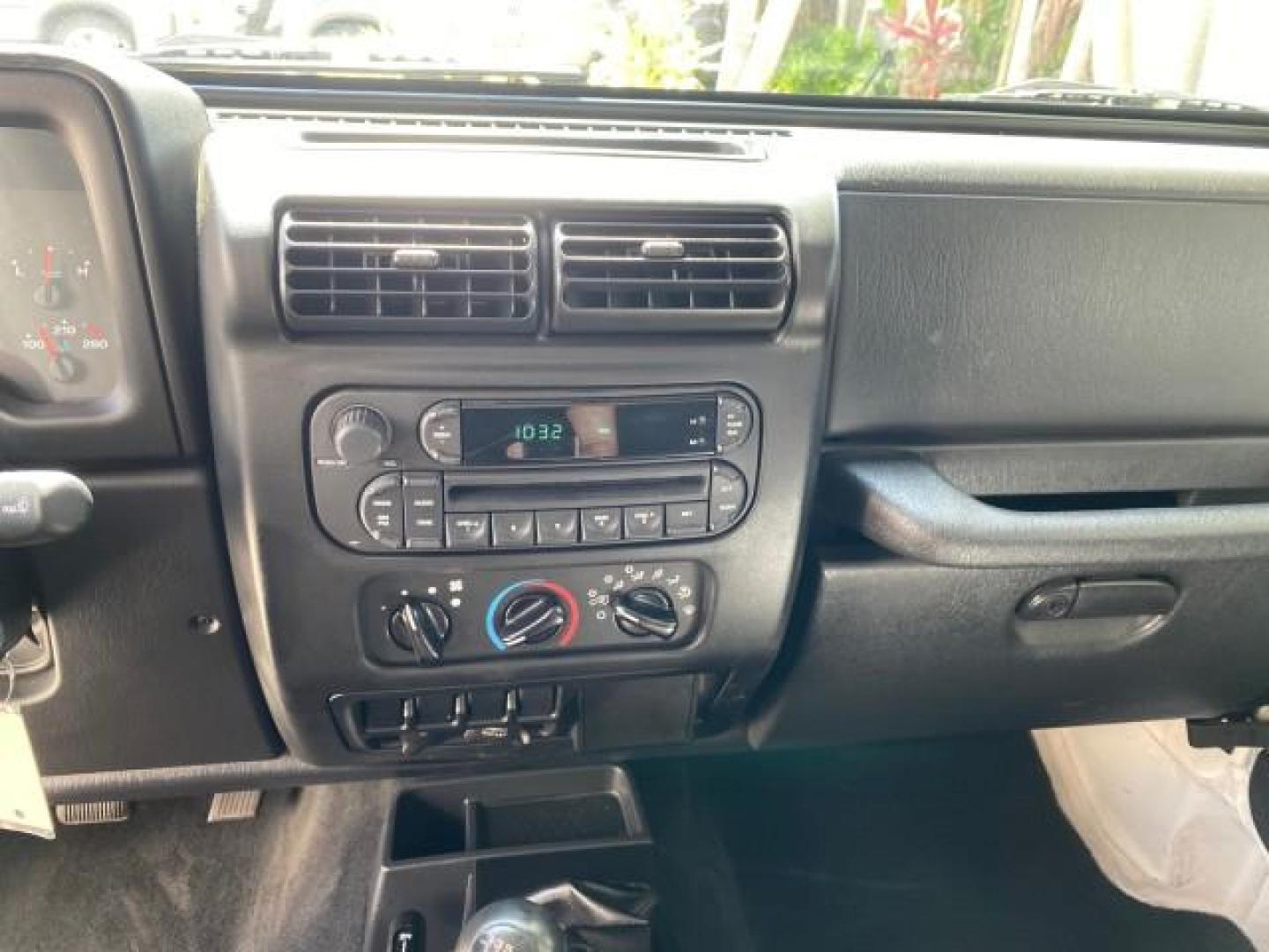 2005 Stone White /Dark Slate Gray Jeep Wrangler SE 4WD LOW MILES 29,371 1 OWNER (1J4FA29105P) with an 2.4L SMPI DOHC 16v 4-Cyl Engine engine, Manual transmission, located at 4701 North Dixie Hwy, Pompano Beach, FL, 33064, (954) 422-2889, 26.240938, -80.123474 - OUR WEBPAGE FLORIDACARS1.COM HAS OVER 100 PHOTOS AND FREE CARFAX LINK 2005 Jeep Wrangler SE 4WD 1 OWNER FACTORY ICE COLD AC 6 SPEED MANUAL Utility 2.4L I4 F Gasoline 21 MPG Rear Wheel Drive w/ 4X4 Features 4WD/AWD Air Conditioning Alloy Wheels AM/FM Stereo CD Audio Cloth Seats Manual Transmission So- Photo#54