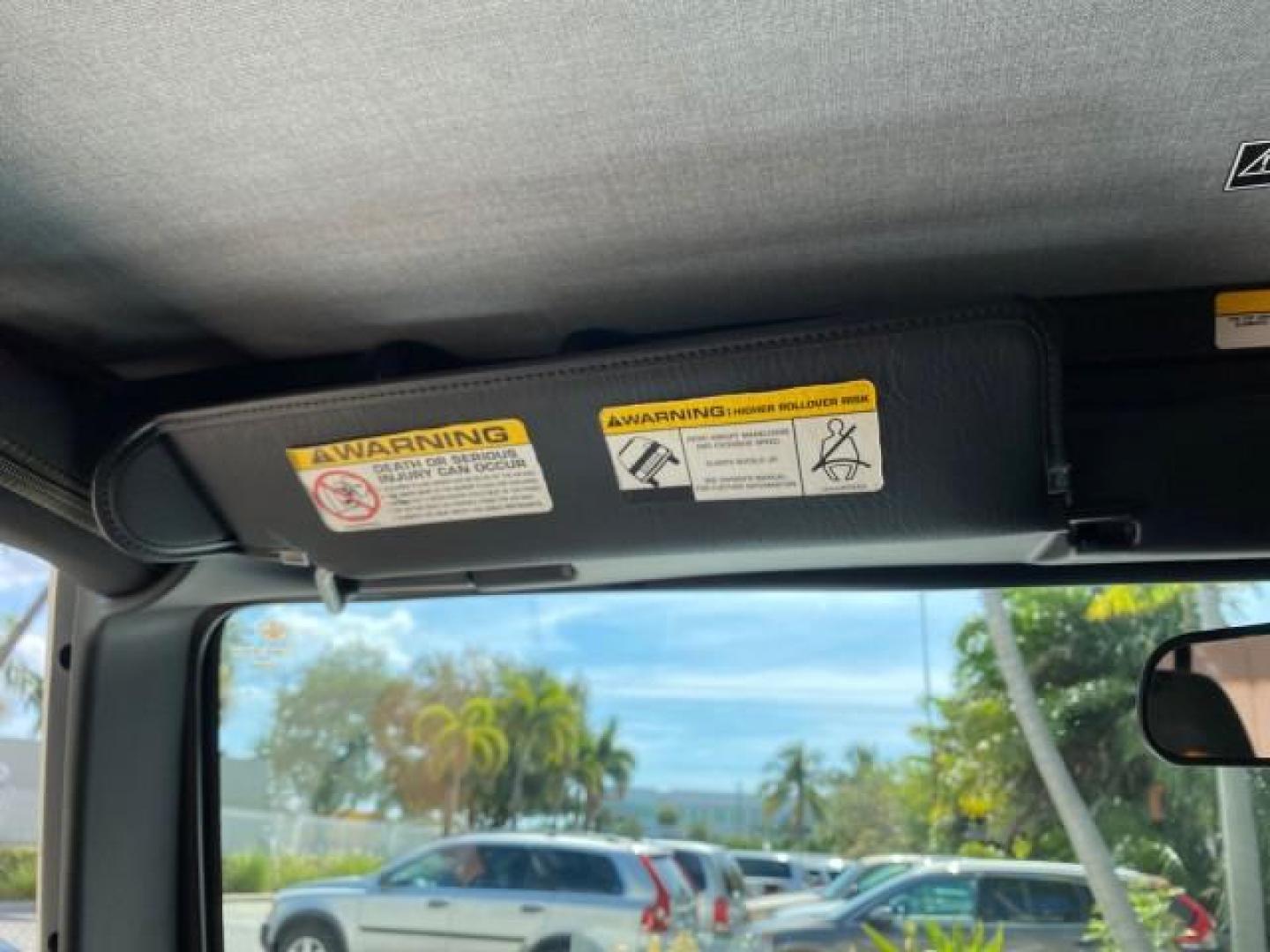 2005 Stone White /Dark Slate Gray Jeep Wrangler SE 4WD LOW MILES 29,371 1 OWNER (1J4FA29105P) with an 2.4L SMPI DOHC 16v 4-Cyl Engine engine, Manual transmission, located at 4701 North Dixie Hwy, Pompano Beach, FL, 33064, (954) 422-2889, 26.240938, -80.123474 - OUR WEBPAGE FLORIDACARS1.COM HAS OVER 100 PHOTOS AND FREE CARFAX LINK 2005 Jeep Wrangler SE 4WD 1 OWNER FACTORY ICE COLD AC 6 SPEED MANUAL Utility 2.4L I4 F Gasoline 21 MPG Rear Wheel Drive w/ 4X4 Features 4WD/AWD Air Conditioning Alloy Wheels AM/FM Stereo CD Audio Cloth Seats Manual Transmission So- Photo#65