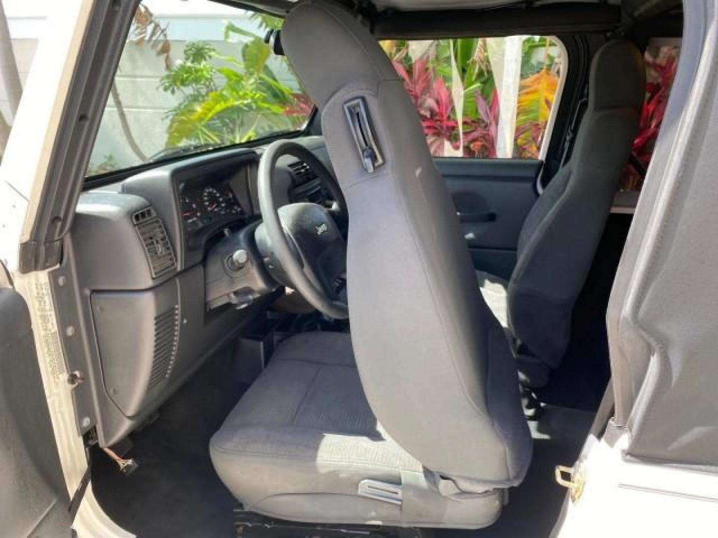 2005 Stone White /Dark Slate Gray Jeep Wrangler SE 4WD LOW MILES 29,371 1 OWNER (1J4FA29105P) with an 2.4L SMPI DOHC 16v 4-Cyl Engine engine, Manual transmission, located at 4701 North Dixie Hwy, Pompano Beach, FL, 33064, (954) 422-2889, 26.240938, -80.123474 - OUR WEBPAGE FLORIDACARS1.COM HAS OVER 100 PHOTOS AND FREE CARFAX LINK 2005 Jeep Wrangler SE 4WD 1 OWNER FACTORY ICE COLD AC 6 SPEED MANUAL Utility 2.4L I4 F Gasoline 21 MPG Rear Wheel Drive w/ 4X4 Features 4WD/AWD Air Conditioning Alloy Wheels AM/FM Stereo CD Audio Cloth Seats Manual Transmission So- Photo#69