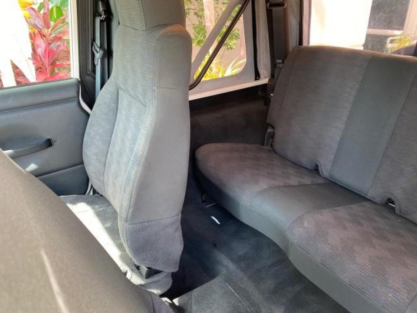 2005 Stone White /Dark Slate Gray Jeep Wrangler SE 4WD LOW MILES 29,371 1 OWNER (1J4FA29105P) with an 2.4L SMPI DOHC 16v 4-Cyl Engine engine, Manual transmission, located at 4701 North Dixie Hwy, Pompano Beach, FL, 33064, (954) 422-2889, 26.240938, -80.123474 - OUR WEBPAGE FLORIDACARS1.COM HAS OVER 100 PHOTOS AND FREE CARFAX LINK 2005 Jeep Wrangler SE 4WD 1 OWNER FACTORY ICE COLD AC 6 SPEED MANUAL Utility 2.4L I4 F Gasoline 21 MPG Rear Wheel Drive w/ 4X4 Features 4WD/AWD Air Conditioning Alloy Wheels AM/FM Stereo CD Audio Cloth Seats Manual Transmission So- Photo#70