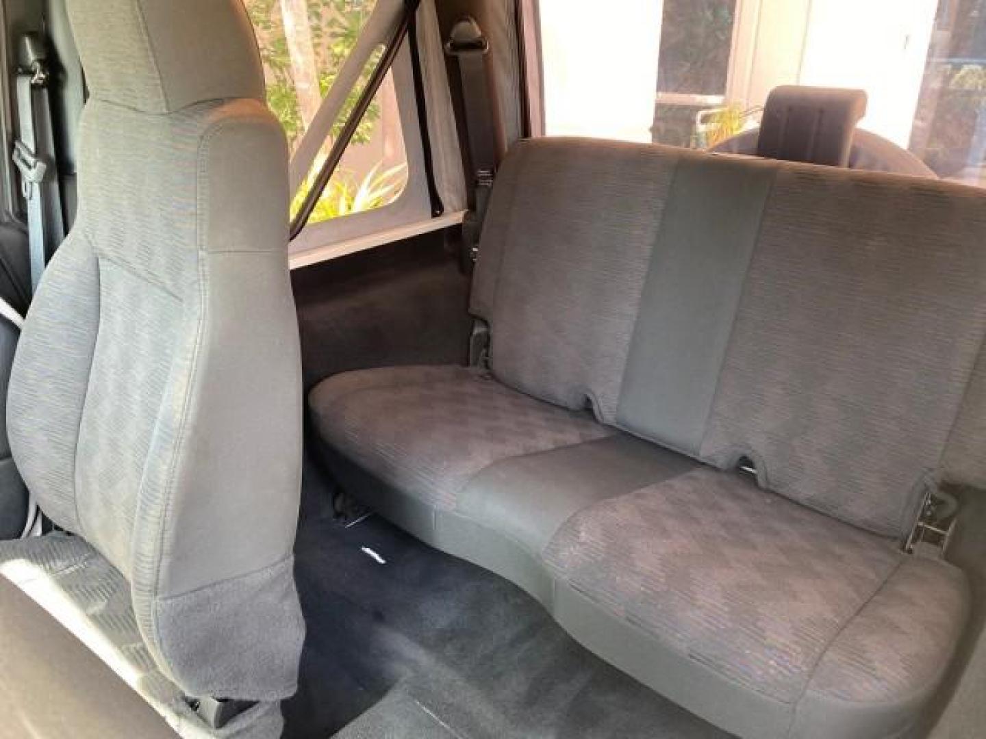 2005 Stone White /Dark Slate Gray Jeep Wrangler SE 4WD LOW MILES 29,371 1 OWNER (1J4FA29105P) with an 2.4L SMPI DOHC 16v 4-Cyl Engine engine, Manual transmission, located at 4701 North Dixie Hwy, Pompano Beach, FL, 33064, (954) 422-2889, 26.240938, -80.123474 - OUR WEBPAGE FLORIDACARS1.COM HAS OVER 100 PHOTOS AND FREE CARFAX LINK 2005 Jeep Wrangler SE 4WD 1 OWNER FACTORY ICE COLD AC 6 SPEED MANUAL Utility 2.4L I4 F Gasoline 21 MPG Rear Wheel Drive w/ 4X4 Features 4WD/AWD Air Conditioning Alloy Wheels AM/FM Stereo CD Audio Cloth Seats Manual Transmission So- Photo#71