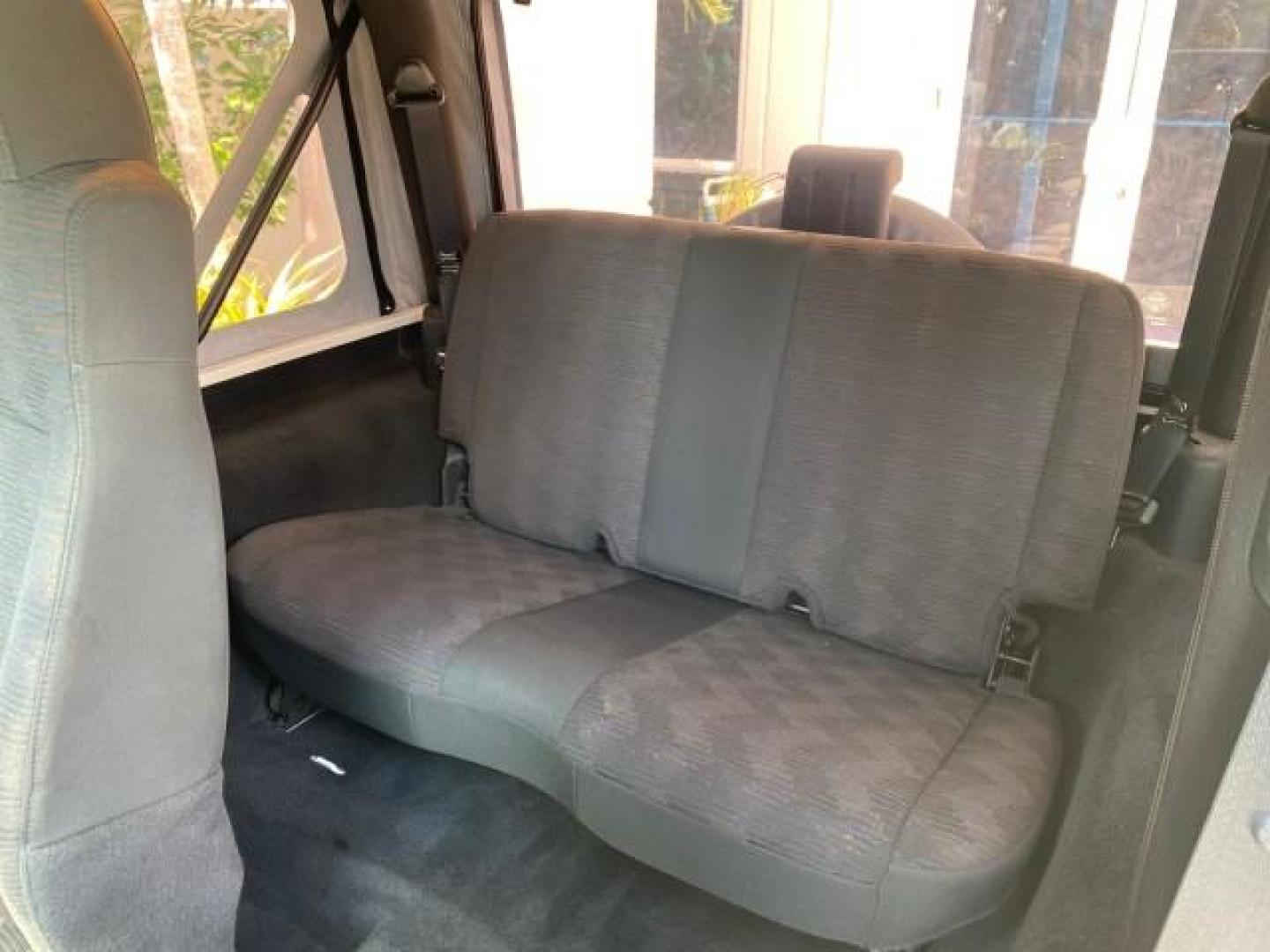 2005 Stone White /Dark Slate Gray Jeep Wrangler SE 4WD LOW MILES 29,371 1 OWNER (1J4FA29105P) with an 2.4L SMPI DOHC 16v 4-Cyl Engine engine, Manual transmission, located at 4701 North Dixie Hwy, Pompano Beach, FL, 33064, (954) 422-2889, 26.240938, -80.123474 - OUR WEBPAGE FLORIDACARS1.COM HAS OVER 100 PHOTOS AND FREE CARFAX LINK 2005 Jeep Wrangler SE 4WD 1 OWNER FACTORY ICE COLD AC 6 SPEED MANUAL Utility 2.4L I4 F Gasoline 21 MPG Rear Wheel Drive w/ 4X4 Features 4WD/AWD Air Conditioning Alloy Wheels AM/FM Stereo CD Audio Cloth Seats Manual Transmission So- Photo#72