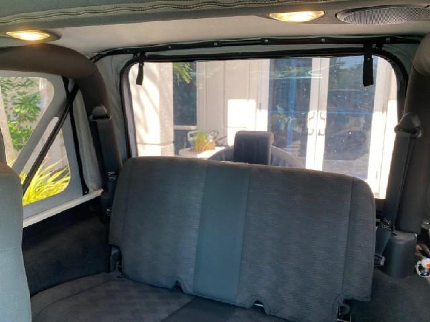 2005 Stone White /Dark Slate Gray Jeep Wrangler SE 4WD LOW MILES 29,371 1 OWNER (1J4FA29105P) with an 2.4L SMPI DOHC 16v 4-Cyl Engine engine, Manual transmission, located at 4701 North Dixie Hwy, Pompano Beach, FL, 33064, (954) 422-2889, 26.240938, -80.123474 - OUR WEBPAGE FLORIDACARS1.COM HAS OVER 100 PHOTOS AND FREE CARFAX LINK 2005 Jeep Wrangler SE 4WD 1 OWNER FACTORY ICE COLD AC 6 SPEED MANUAL Utility 2.4L I4 F Gasoline 21 MPG Rear Wheel Drive w/ 4X4 Features 4WD/AWD Air Conditioning Alloy Wheels AM/FM Stereo CD Audio Cloth Seats Manual Transmission So- Photo#74
