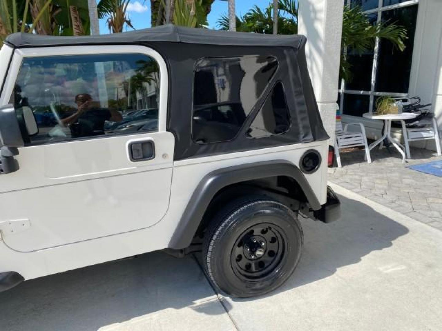 2005 Stone White /Dark Slate Gray Jeep Wrangler SE 4WD LOW MILES 29,371 1 OWNER (1J4FA29105P) with an 2.4L SMPI DOHC 16v 4-Cyl Engine engine, Manual transmission, located at 4701 North Dixie Hwy, Pompano Beach, FL, 33064, (954) 422-2889, 26.240938, -80.123474 - OUR WEBPAGE FLORIDACARS1.COM HAS OVER 100 PHOTOS AND FREE CARFAX LINK 2005 Jeep Wrangler SE 4WD 1 OWNER FACTORY ICE COLD AC 6 SPEED MANUAL Utility 2.4L I4 F Gasoline 21 MPG Rear Wheel Drive w/ 4X4 Features 4WD/AWD Air Conditioning Alloy Wheels AM/FM Stereo CD Audio Cloth Seats Manual Transmission So- Photo#75