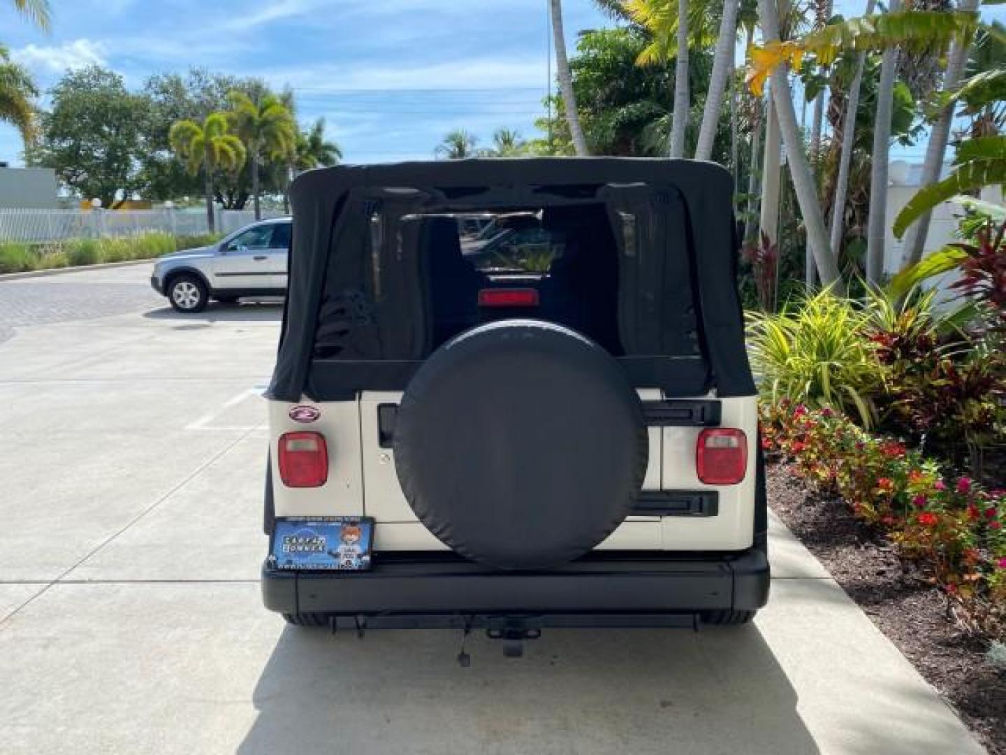 2005 Stone White /Dark Slate Gray Jeep Wrangler SE 4WD LOW MILES 29,371 1 OWNER (1J4FA29105P) with an 2.4L SMPI DOHC 16v 4-Cyl Engine engine, Manual transmission, located at 4701 North Dixie Hwy, Pompano Beach, FL, 33064, (954) 422-2889, 26.240938, -80.123474 - OUR WEBPAGE FLORIDACARS1.COM HAS OVER 100 PHOTOS AND FREE CARFAX LINK 2005 Jeep Wrangler SE 4WD 1 OWNER FACTORY ICE COLD AC 6 SPEED MANUAL Utility 2.4L I4 F Gasoline 21 MPG Rear Wheel Drive w/ 4X4 Features 4WD/AWD Air Conditioning Alloy Wheels AM/FM Stereo CD Audio Cloth Seats Manual Transmission So- Photo#79