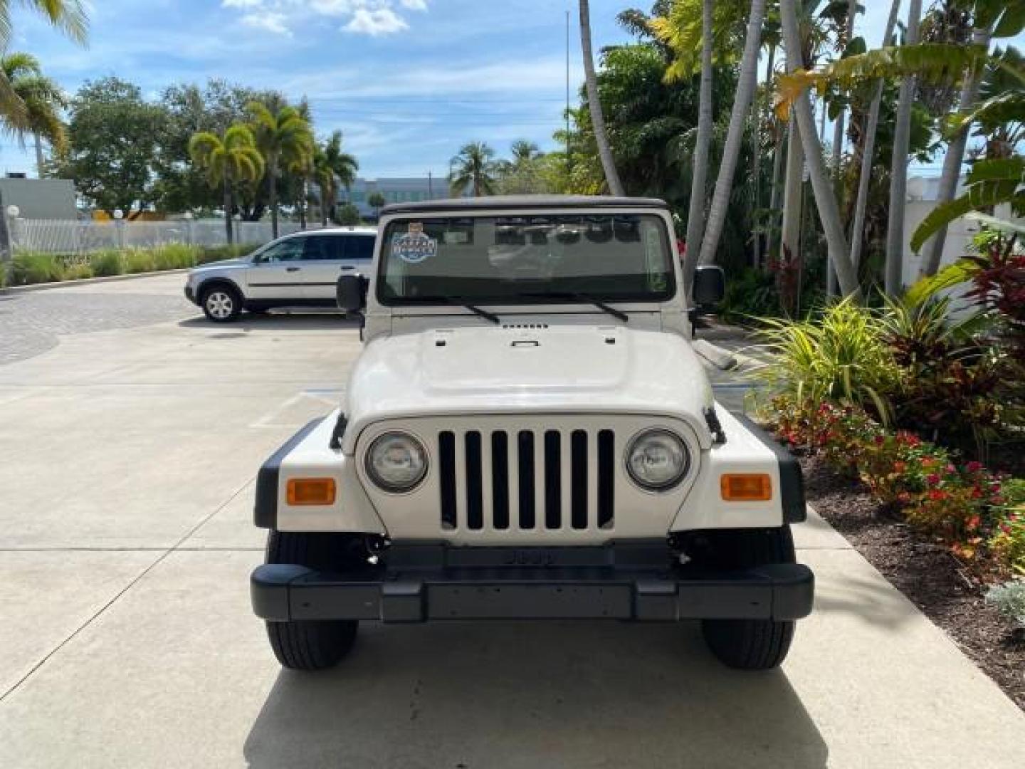 2005 Stone White /Dark Slate Gray Jeep Wrangler SE 4WD LOW MILES 29,371 1 OWNER (1J4FA29105P) with an 2.4L SMPI DOHC 16v 4-Cyl Engine engine, Manual transmission, located at 4701 North Dixie Hwy, Pompano Beach, FL, 33064, (954) 422-2889, 26.240938, -80.123474 - OUR WEBPAGE FLORIDACARS1.COM HAS OVER 100 PHOTOS AND FREE CARFAX LINK 2005 Jeep Wrangler SE 4WD 1 OWNER FACTORY ICE COLD AC 6 SPEED MANUAL Utility 2.4L I4 F Gasoline 21 MPG Rear Wheel Drive w/ 4X4 Features 4WD/AWD Air Conditioning Alloy Wheels AM/FM Stereo CD Audio Cloth Seats Manual Transmission So- Photo#93
