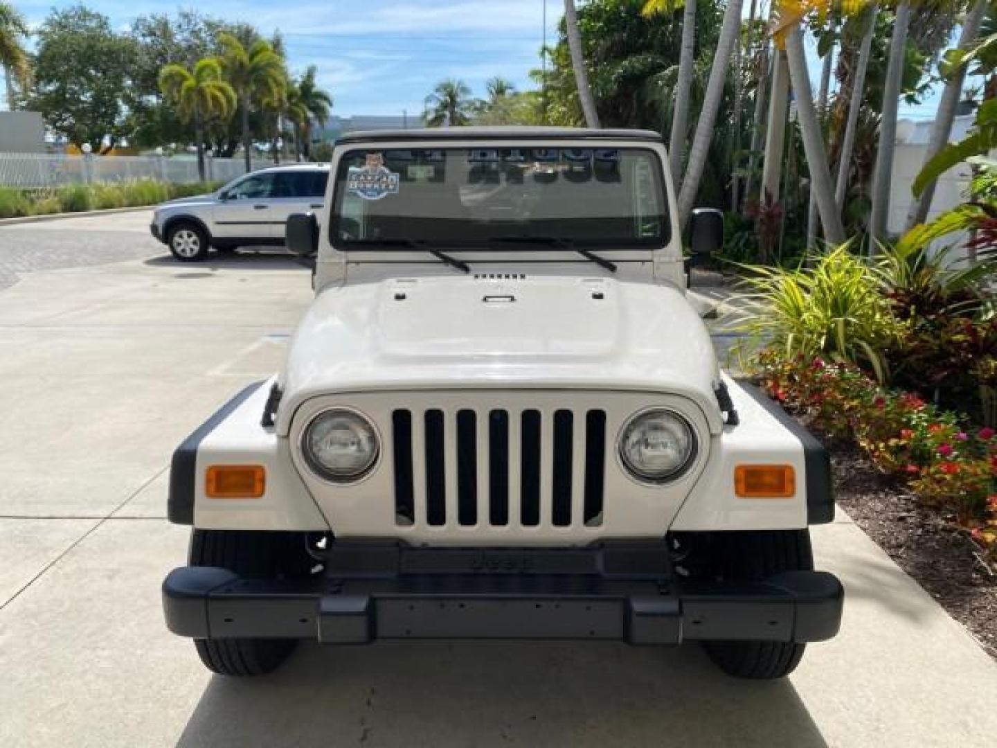 2005 Stone White /Dark Slate Gray Jeep Wrangler SE 4WD LOW MILES 29,371 1 OWNER (1J4FA29105P) with an 2.4L SMPI DOHC 16v 4-Cyl Engine engine, Manual transmission, located at 4701 North Dixie Hwy, Pompano Beach, FL, 33064, (954) 422-2889, 26.240938, -80.123474 - OUR WEBPAGE FLORIDACARS1.COM HAS OVER 100 PHOTOS AND FREE CARFAX LINK 2005 Jeep Wrangler SE 4WD 1 OWNER FACTORY ICE COLD AC 6 SPEED MANUAL Utility 2.4L I4 F Gasoline 21 MPG Rear Wheel Drive w/ 4X4 Features 4WD/AWD Air Conditioning Alloy Wheels AM/FM Stereo CD Audio Cloth Seats Manual Transmission So- Photo#94