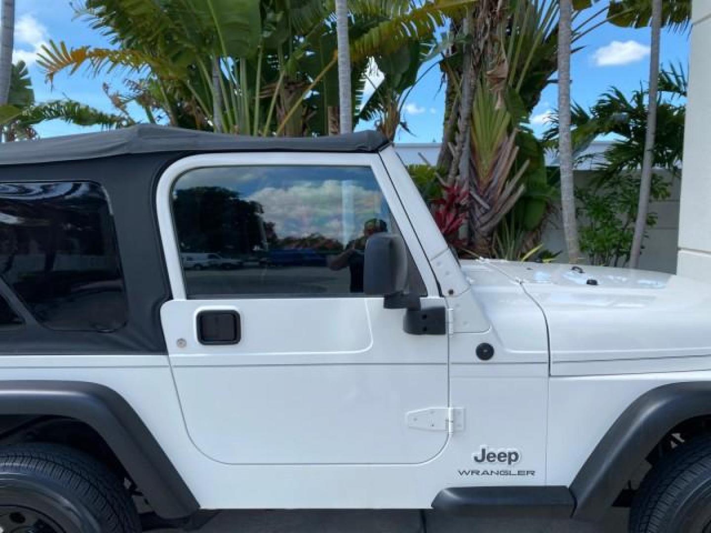 2005 Stone White /Dark Slate Gray Jeep Wrangler SE 4WD LOW MILES 29,371 1 OWNER (1J4FA29105P) with an 2.4L SMPI DOHC 16v 4-Cyl Engine engine, Manual transmission, located at 4701 North Dixie Hwy, Pompano Beach, FL, 33064, (954) 422-2889, 26.240938, -80.123474 - OUR WEBPAGE FLORIDACARS1.COM HAS OVER 100 PHOTOS AND FREE CARFAX LINK 2005 Jeep Wrangler SE 4WD 1 OWNER FACTORY ICE COLD AC 6 SPEED MANUAL Utility 2.4L I4 F Gasoline 21 MPG Rear Wheel Drive w/ 4X4 Features 4WD/AWD Air Conditioning Alloy Wheels AM/FM Stereo CD Audio Cloth Seats Manual Transmission So- Photo#97