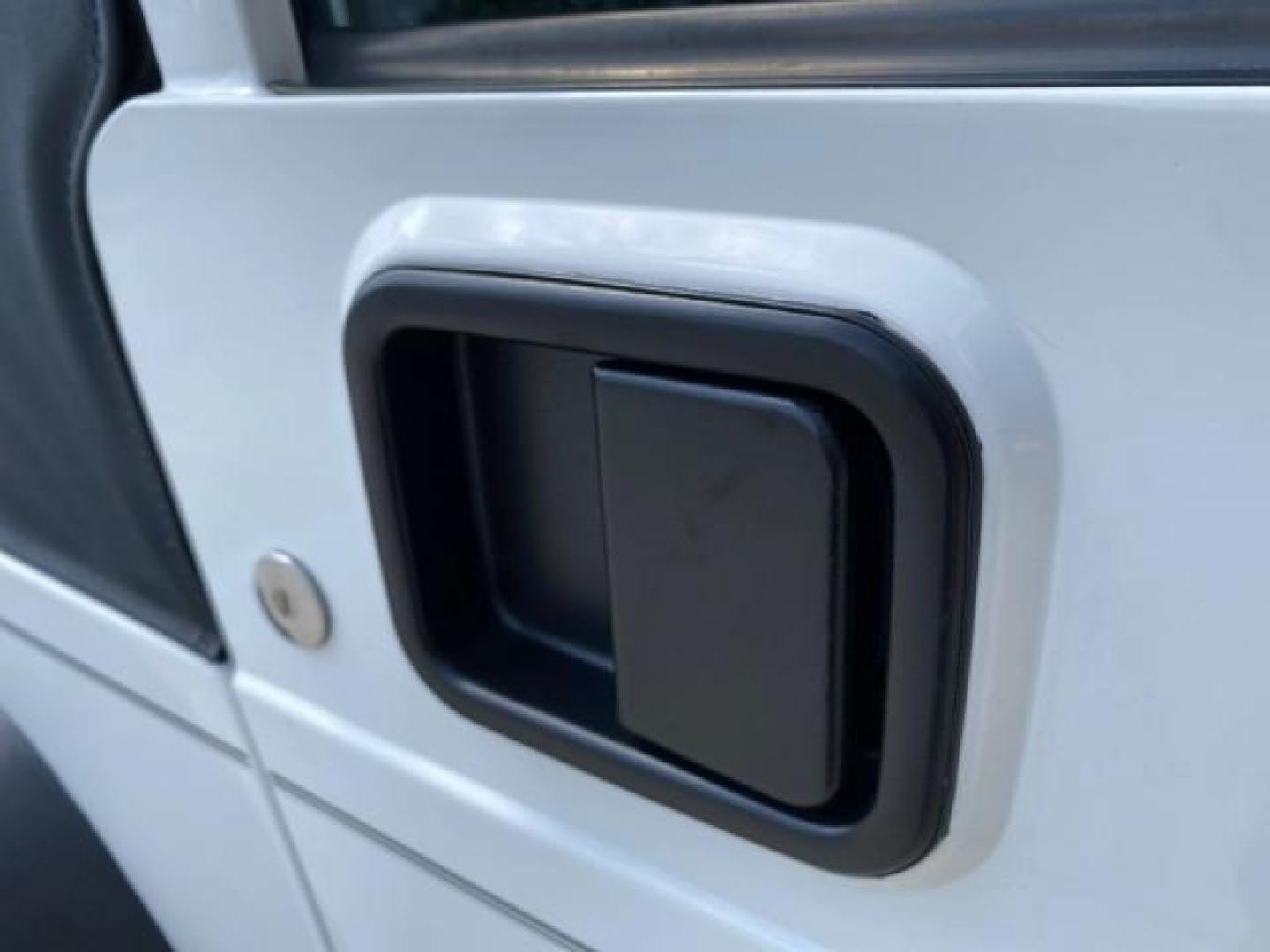2005 Stone White /Dark Slate Gray Jeep Wrangler SE 4WD LOW MILES 29,371 1 OWNER (1J4FA29105P) with an 2.4L SMPI DOHC 16v 4-Cyl Engine engine, Manual transmission, located at 4701 North Dixie Hwy, Pompano Beach, FL, 33064, (954) 422-2889, 26.240938, -80.123474 - OUR WEBPAGE FLORIDACARS1.COM HAS OVER 100 PHOTOS AND FREE CARFAX LINK 2005 Jeep Wrangler SE 4WD 1 OWNER FACTORY ICE COLD AC 6 SPEED MANUAL Utility 2.4L I4 F Gasoline 21 MPG Rear Wheel Drive w/ 4X4 Features 4WD/AWD Air Conditioning Alloy Wheels AM/FM Stereo CD Audio Cloth Seats Manual Transmission So- Photo#98