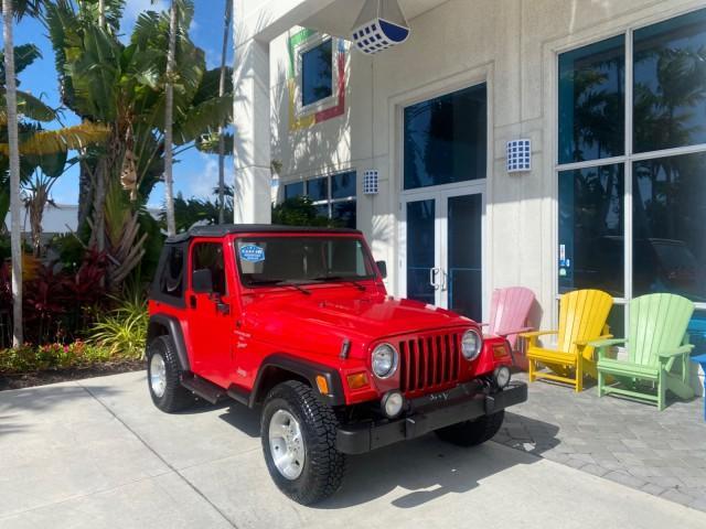 1999 Flame Red /Agate Jeep Wrangler Sport AUTO AC 4.0 6 CYL LOW MILES 92,727 (1J4FY19S2XP) with an 4.0L SMPI I6 Power Tech Engine engine, Automatic transmission, located at 4701 North Dixie Hwy, Pompano Beach, FL, 33064, (954) 422-2889, 26.240938, -80.123474 - OUR WEBPAGE FLORIDACARS1.COM HAS OVER 100 PHOTOS AND FREE CARFAX LINK 1999 Jeep Wrangler Sport 4WD Utility 4.0L I6 F Gasoline 20 MPG Rear Wheel Drive w/ 4X4 Features 4WD/AWD Air Conditioning Alloy Wheels AM/FM Stereo Automatic Transmission CD Audio Cloth Seats Cruise Control Running Boards Soft Top- Photo#1