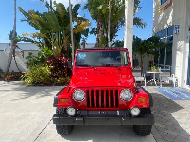 1999 Flame Red /Agate Jeep Wrangler Sport AUTO AC 4.0 6 CYL LOW MILES 92,727 (1J4FY19S2XP) with an 4.0L SMPI I6 Power Tech Engine engine, Automatic transmission, located at 4701 North Dixie Hwy, Pompano Beach, FL, 33064, (954) 422-2889, 26.240938, -80.123474 - OUR WEBPAGE FLORIDACARS1.COM HAS OVER 100 PHOTOS AND FREE CARFAX LINK 1999 Jeep Wrangler Sport 4WD Utility 4.0L I6 F Gasoline 20 MPG Rear Wheel Drive w/ 4X4 Features 4WD/AWD Air Conditioning Alloy Wheels AM/FM Stereo Automatic Transmission CD Audio Cloth Seats Cruise Control Running Boards Soft Top- Photo#2