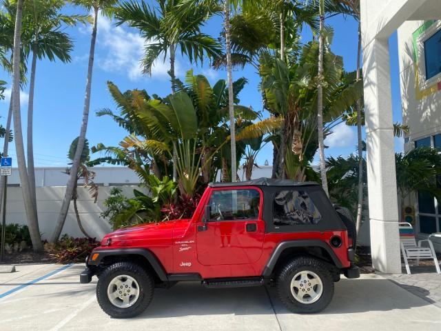 1999 Flame Red /Agate Jeep Wrangler Sport AUTO AC 4.0 6 CYL LOW MILES 92,727 (1J4FY19S2XP) with an 4.0L SMPI I6 Power Tech Engine engine, Automatic transmission, located at 4701 North Dixie Hwy, Pompano Beach, FL, 33064, (954) 422-2889, 26.240938, -80.123474 - OUR WEBPAGE FLORIDACARS1.COM HAS OVER 100 PHOTOS AND FREE CARFAX LINK 1999 Jeep Wrangler Sport 4WD Utility 4.0L I6 F Gasoline 20 MPG Rear Wheel Drive w/ 4X4 Features 4WD/AWD Air Conditioning Alloy Wheels AM/FM Stereo Automatic Transmission CD Audio Cloth Seats Cruise Control Running Boards Soft Top- Photo#4