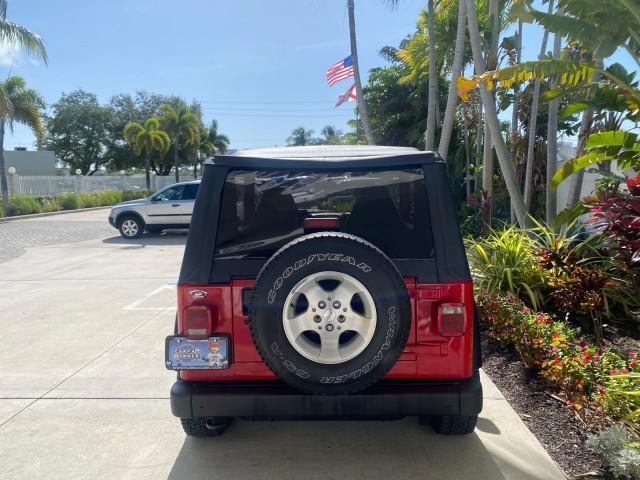 1999 Flame Red /Agate Jeep Wrangler Sport AUTO AC 4.0 6 CYL LOW MILES 92,727 (1J4FY19S2XP) with an 4.0L SMPI I6 Power Tech Engine engine, Automatic transmission, located at 4701 North Dixie Hwy, Pompano Beach, FL, 33064, (954) 422-2889, 26.240938, -80.123474 - OUR WEBPAGE FLORIDACARS1.COM HAS OVER 100 PHOTOS AND FREE CARFAX LINK 1999 Jeep Wrangler Sport 4WD Utility 4.0L I6 F Gasoline 20 MPG Rear Wheel Drive w/ 4X4 Features 4WD/AWD Air Conditioning Alloy Wheels AM/FM Stereo Automatic Transmission CD Audio Cloth Seats Cruise Control Running Boards Soft Top- Photo#6