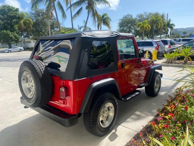 1999 Flame Red /Agate Jeep Wrangler Sport AUTO AC 4.0 6 CYL LOW MILES 92,727 (1J4FY19S2XP) with an 4.0L SMPI I6 Power Tech Engine engine, Automatic transmission, located at 4701 North Dixie Hwy, Pompano Beach, FL, 33064, (954) 422-2889, 26.240938, -80.123474 - OUR WEBPAGE FLORIDACARS1.COM HAS OVER 100 PHOTOS AND FREE CARFAX LINK 1999 Jeep Wrangler Sport 4WD Utility 4.0L I6 F Gasoline 20 MPG Rear Wheel Drive w/ 4X4 Features 4WD/AWD Air Conditioning Alloy Wheels AM/FM Stereo Automatic Transmission CD Audio Cloth Seats Cruise Control Running Boards Soft Top- Photo#7