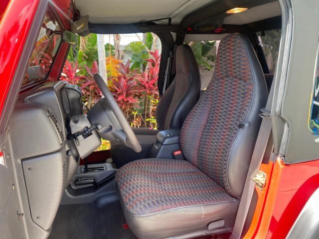 1999 Flame Red /Agate Jeep Wrangler Sport AUTO AC 4.0 6 CYL LOW MILES 92,727 (1J4FY19S2XP) with an 4.0L SMPI I6 Power Tech Engine engine, Automatic transmission, located at 4701 North Dixie Hwy, Pompano Beach, FL, 33064, (954) 422-2889, 26.240938, -80.123474 - OUR WEBPAGE FLORIDACARS1.COM HAS OVER 100 PHOTOS AND FREE CARFAX LINK 1999 Jeep Wrangler Sport 4WD Utility 4.0L I6 F Gasoline 20 MPG Rear Wheel Drive w/ 4X4 Features 4WD/AWD Air Conditioning Alloy Wheels AM/FM Stereo Automatic Transmission CD Audio Cloth Seats Cruise Control Running Boards Soft Top- Photo#10
