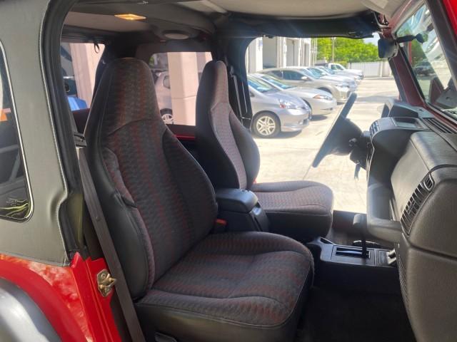 1999 Flame Red /Agate Jeep Wrangler Sport AUTO AC 4.0 6 CYL LOW MILES 92,727 (1J4FY19S2XP) with an 4.0L SMPI I6 Power Tech Engine engine, Automatic transmission, located at 4701 North Dixie Hwy, Pompano Beach, FL, 33064, (954) 422-2889, 26.240938, -80.123474 - OUR WEBPAGE FLORIDACARS1.COM HAS OVER 100 PHOTOS AND FREE CARFAX LINK 1999 Jeep Wrangler Sport 4WD Utility 4.0L I6 F Gasoline 20 MPG Rear Wheel Drive w/ 4X4 Features 4WD/AWD Air Conditioning Alloy Wheels AM/FM Stereo Automatic Transmission CD Audio Cloth Seats Cruise Control Running Boards Soft Top- Photo#12