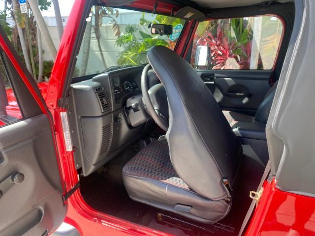 1999 Flame Red /Agate Jeep Wrangler Sport AUTO AC 4.0 6 CYL LOW MILES 92,727 (1J4FY19S2XP) with an 4.0L SMPI I6 Power Tech Engine engine, Automatic transmission, located at 4701 North Dixie Hwy, Pompano Beach, FL, 33064, (954) 422-2889, 26.240938, -80.123474 - OUR WEBPAGE FLORIDACARS1.COM HAS OVER 100 PHOTOS AND FREE CARFAX LINK 1999 Jeep Wrangler Sport 4WD Utility 4.0L I6 F Gasoline 20 MPG Rear Wheel Drive w/ 4X4 Features 4WD/AWD Air Conditioning Alloy Wheels AM/FM Stereo Automatic Transmission CD Audio Cloth Seats Cruise Control Running Boards Soft Top- Photo#13