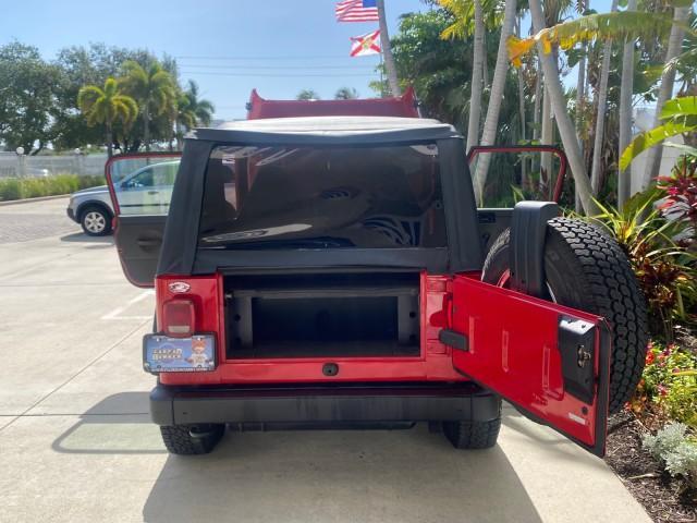 1999 Flame Red /Agate Jeep Wrangler Sport AUTO AC 4.0 6 CYL LOW MILES 92,727 (1J4FY19S2XP) with an 4.0L SMPI I6 Power Tech Engine engine, Automatic transmission, located at 4701 North Dixie Hwy, Pompano Beach, FL, 33064, (954) 422-2889, 26.240938, -80.123474 - OUR WEBPAGE FLORIDACARS1.COM HAS OVER 100 PHOTOS AND FREE CARFAX LINK 1999 Jeep Wrangler Sport 4WD Utility 4.0L I6 F Gasoline 20 MPG Rear Wheel Drive w/ 4X4 Features 4WD/AWD Air Conditioning Alloy Wheels AM/FM Stereo Automatic Transmission CD Audio Cloth Seats Cruise Control Running Boards Soft Top- Photo#15