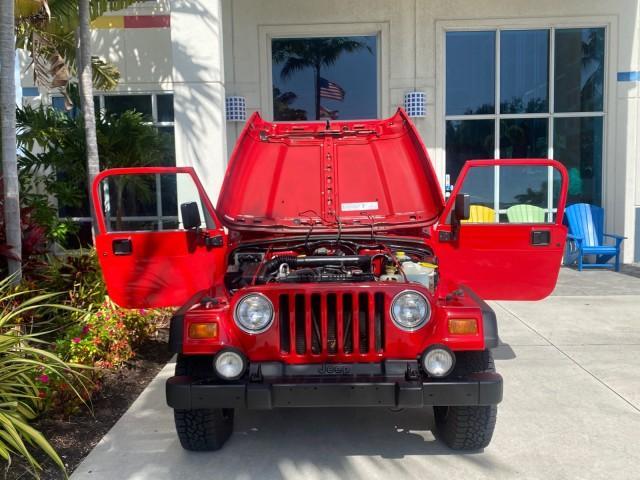 1999 Flame Red /Agate Jeep Wrangler Sport AUTO AC 4.0 6 CYL LOW MILES 92,727 (1J4FY19S2XP) with an 4.0L SMPI I6 Power Tech Engine engine, Automatic transmission, located at 4701 North Dixie Hwy, Pompano Beach, FL, 33064, (954) 422-2889, 26.240938, -80.123474 - OUR WEBPAGE FLORIDACARS1.COM HAS OVER 100 PHOTOS AND FREE CARFAX LINK 1999 Jeep Wrangler Sport 4WD Utility 4.0L I6 F Gasoline 20 MPG Rear Wheel Drive w/ 4X4 Features 4WD/AWD Air Conditioning Alloy Wheels AM/FM Stereo Automatic Transmission CD Audio Cloth Seats Cruise Control Running Boards Soft Top- Photo#16