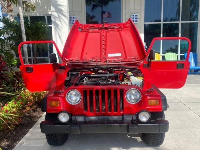 1999 Flame Red /Agate Jeep Wrangler Sport AUTO AC 4.0 6 CYL LOW MILES 92,727 (1J4FY19S2XP) with an 4.0L SMPI I6 Power Tech Engine engine, Automatic transmission, located at 4701 North Dixie Hwy, Pompano Beach, FL, 33064, (954) 422-2889, 26.240938, -80.123474 - OUR WEBPAGE FLORIDACARS1.COM HAS OVER 100 PHOTOS AND FREE CARFAX LINK 1999 Jeep Wrangler Sport 4WD Utility 4.0L I6 F Gasoline 20 MPG Rear Wheel Drive w/ 4X4 Features 4WD/AWD Air Conditioning Alloy Wheels AM/FM Stereo Automatic Transmission CD Audio Cloth Seats Cruise Control Running Boards Soft Top- Photo#17