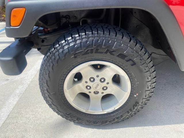 1999 Flame Red /Agate Jeep Wrangler Sport AUTO AC 4.0 6 CYL LOW MILES 92,727 (1J4FY19S2XP) with an 4.0L SMPI I6 Power Tech Engine engine, Automatic transmission, located at 4701 North Dixie Hwy, Pompano Beach, FL, 33064, (954) 422-2889, 26.240938, -80.123474 - OUR WEBPAGE FLORIDACARS1.COM HAS OVER 100 PHOTOS AND FREE CARFAX LINK 1999 Jeep Wrangler Sport 4WD Utility 4.0L I6 F Gasoline 20 MPG Rear Wheel Drive w/ 4X4 Features 4WD/AWD Air Conditioning Alloy Wheels AM/FM Stereo Automatic Transmission CD Audio Cloth Seats Cruise Control Running Boards Soft Top- Photo#19