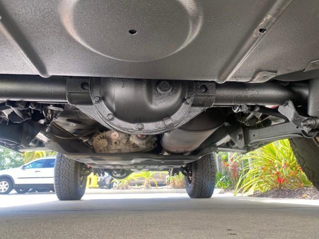 1999 Flame Red /Agate Jeep Wrangler Sport AUTO AC 4.0 6 CYL LOW MILES 92,727 (1J4FY19S2XP) with an 4.0L SMPI I6 Power Tech Engine engine, Automatic transmission, located at 4701 North Dixie Hwy, Pompano Beach, FL, 33064, (954) 422-2889, 26.240938, -80.123474 - OUR WEBPAGE FLORIDACARS1.COM HAS OVER 100 PHOTOS AND FREE CARFAX LINK 1999 Jeep Wrangler Sport 4WD Utility 4.0L I6 F Gasoline 20 MPG Rear Wheel Drive w/ 4X4 Features 4WD/AWD Air Conditioning Alloy Wheels AM/FM Stereo Automatic Transmission CD Audio Cloth Seats Cruise Control Running Boards Soft Top- Photo#22