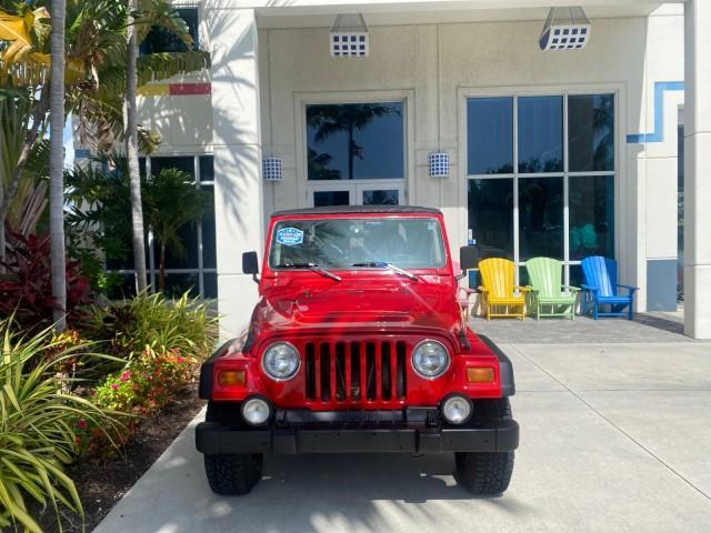 1999 Flame Red /Agate Jeep Wrangler Sport AUTO AC 4.0 6 CYL LOW MILES 92,727 (1J4FY19S2XP) with an 4.0L SMPI I6 Power Tech Engine engine, Automatic transmission, located at 4701 North Dixie Hwy, Pompano Beach, FL, 33064, (954) 422-2889, 26.240938, -80.123474 - OUR WEBPAGE FLORIDACARS1.COM HAS OVER 100 PHOTOS AND FREE CARFAX LINK 1999 Jeep Wrangler Sport 4WD Utility 4.0L I6 F Gasoline 20 MPG Rear Wheel Drive w/ 4X4 Features 4WD/AWD Air Conditioning Alloy Wheels AM/FM Stereo Automatic Transmission CD Audio Cloth Seats Cruise Control Running Boards Soft Top- Photo#26