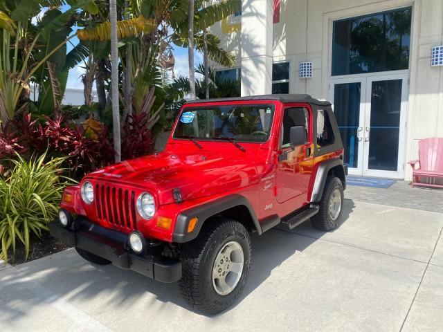 1999 Flame Red /Agate Jeep Wrangler Sport AUTO AC 4.0 6 CYL LOW MILES 92,727 (1J4FY19S2XP) with an 4.0L SMPI I6 Power Tech Engine engine, Automatic transmission, located at 4701 North Dixie Hwy, Pompano Beach, FL, 33064, (954) 422-2889, 26.240938, -80.123474 - OUR WEBPAGE FLORIDACARS1.COM HAS OVER 100 PHOTOS AND FREE CARFAX LINK 1999 Jeep Wrangler Sport 4WD Utility 4.0L I6 F Gasoline 20 MPG Rear Wheel Drive w/ 4X4 Features 4WD/AWD Air Conditioning Alloy Wheels AM/FM Stereo Automatic Transmission CD Audio Cloth Seats Cruise Control Running Boards Soft Top- Photo#28