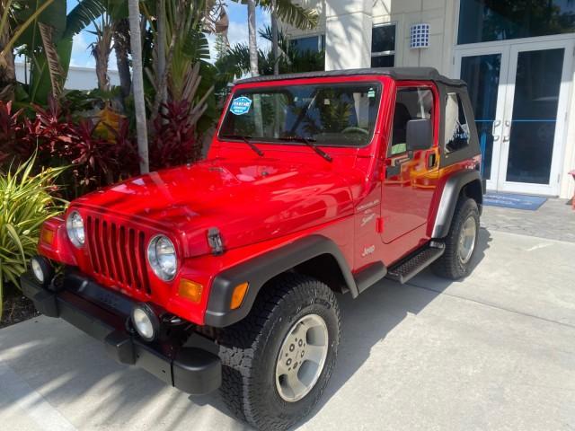 1999 Flame Red /Agate Jeep Wrangler Sport AUTO AC 4.0 6 CYL LOW MILES 92,727 (1J4FY19S2XP) with an 4.0L SMPI I6 Power Tech Engine engine, Automatic transmission, located at 4701 North Dixie Hwy, Pompano Beach, FL, 33064, (954) 422-2889, 26.240938, -80.123474 - OUR WEBPAGE FLORIDACARS1.COM HAS OVER 100 PHOTOS AND FREE CARFAX LINK 1999 Jeep Wrangler Sport 4WD Utility 4.0L I6 F Gasoline 20 MPG Rear Wheel Drive w/ 4X4 Features 4WD/AWD Air Conditioning Alloy Wheels AM/FM Stereo Automatic Transmission CD Audio Cloth Seats Cruise Control Running Boards Soft Top- Photo#29