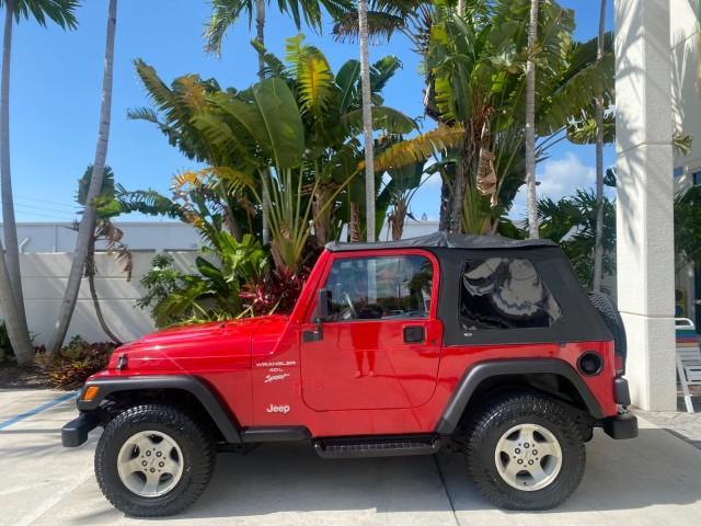 1999 Flame Red /Agate Jeep Wrangler Sport AUTO AC 4.0 6 CYL LOW MILES 92,727 (1J4FY19S2XP) with an 4.0L SMPI I6 Power Tech Engine engine, Automatic transmission, located at 4701 North Dixie Hwy, Pompano Beach, FL, 33064, (954) 422-2889, 26.240938, -80.123474 - OUR WEBPAGE FLORIDACARS1.COM HAS OVER 100 PHOTOS AND FREE CARFAX LINK 1999 Jeep Wrangler Sport 4WD Utility 4.0L I6 F Gasoline 20 MPG Rear Wheel Drive w/ 4X4 Features 4WD/AWD Air Conditioning Alloy Wheels AM/FM Stereo Automatic Transmission CD Audio Cloth Seats Cruise Control Running Boards Soft Top- Photo#31