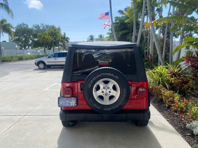1999 Flame Red /Agate Jeep Wrangler Sport AUTO AC 4.0 6 CYL LOW MILES 92,727 (1J4FY19S2XP) with an 4.0L SMPI I6 Power Tech Engine engine, Automatic transmission, located at 4701 North Dixie Hwy, Pompano Beach, FL, 33064, (954) 422-2889, 26.240938, -80.123474 - OUR WEBPAGE FLORIDACARS1.COM HAS OVER 100 PHOTOS AND FREE CARFAX LINK 1999 Jeep Wrangler Sport 4WD Utility 4.0L I6 F Gasoline 20 MPG Rear Wheel Drive w/ 4X4 Features 4WD/AWD Air Conditioning Alloy Wheels AM/FM Stereo Automatic Transmission CD Audio Cloth Seats Cruise Control Running Boards Soft Top- Photo#34