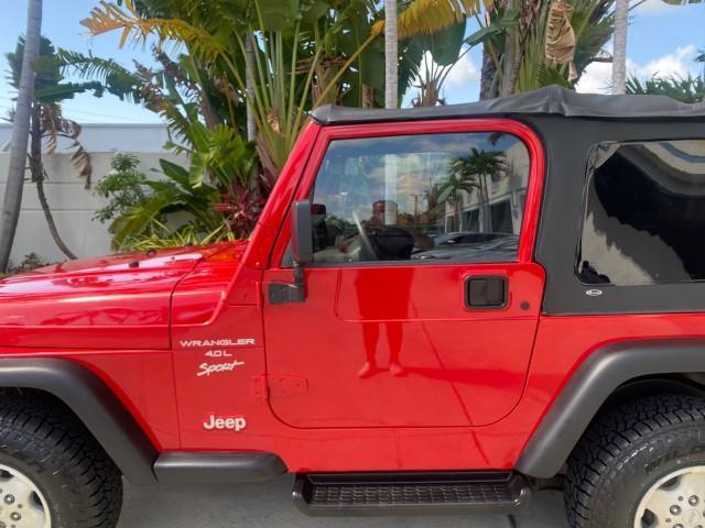 1999 Flame Red /Agate Jeep Wrangler Sport AUTO AC 4.0 6 CYL LOW MILES 92,727 (1J4FY19S2XP) with an 4.0L SMPI I6 Power Tech Engine engine, Automatic transmission, located at 4701 North Dixie Hwy, Pompano Beach, FL, 33064, (954) 422-2889, 26.240938, -80.123474 - OUR WEBPAGE FLORIDACARS1.COM HAS OVER 100 PHOTOS AND FREE CARFAX LINK 1999 Jeep Wrangler Sport 4WD Utility 4.0L I6 F Gasoline 20 MPG Rear Wheel Drive w/ 4X4 Features 4WD/AWD Air Conditioning Alloy Wheels AM/FM Stereo Automatic Transmission CD Audio Cloth Seats Cruise Control Running Boards Soft Top- Photo#36